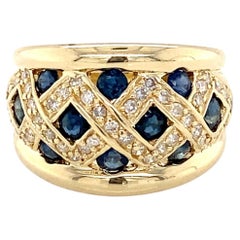 1980s Blue Sapphire and Diamond 14 karat Yellow Gold Low Profile Fashion Ring