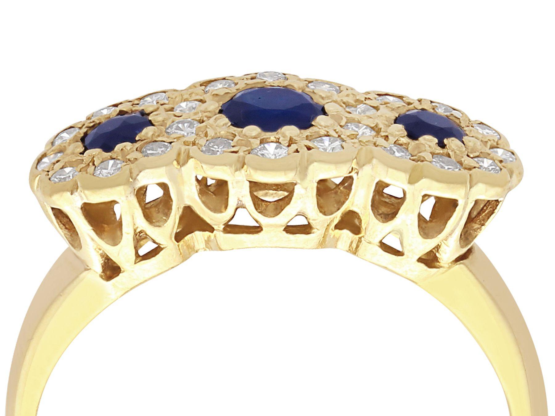 An impressive 0.55 carat natural blue sapphire and 0.46 carat diamond, 18 karat yellow gold dress ring; part of our jewelry and estate jewelry collections

This impressive sapphire and diamond band ring has been crafted in 18k yellow gold.

The