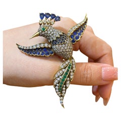 1980s Sapphire Diamond Emerald Bird Brooch in 18k Gold