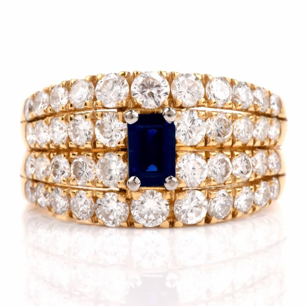 This cocktail ring of feminine grace and refinement is crafted in solid 18-karat yellow gold, weighing; 8.2 grams and measuring 12 mm wide. Centered with a carat emerald-cut blue sapphire approx. 0.40 carats intense royal blue color, the ring is