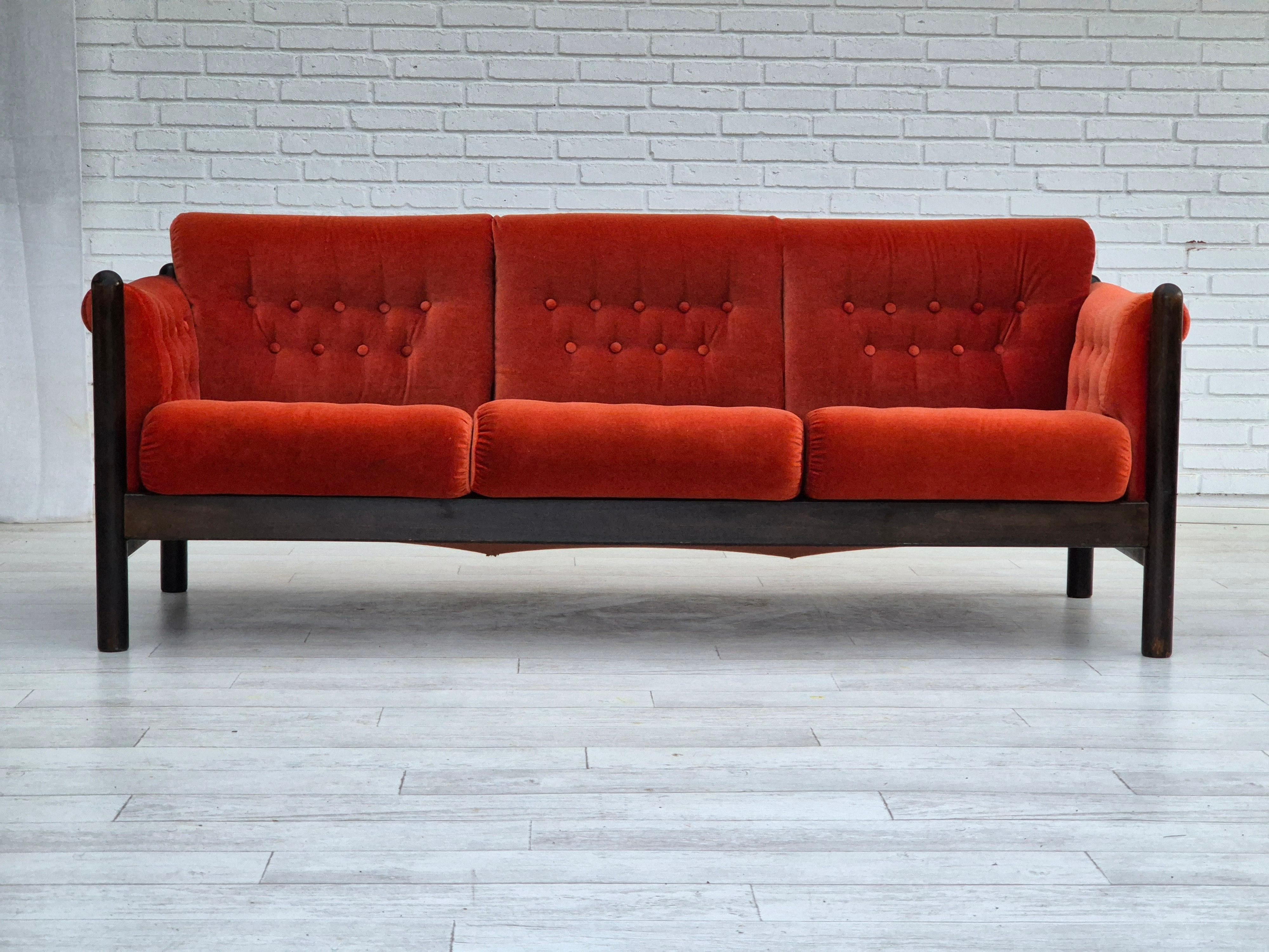 1980s, Scandinavian 3 seater sofa in original very good condition: no smells and no stains. Light red furniture velour, dark oak wood. Manufactured by Norwegian or Danish furniture manufacturer in about 1980-85s.