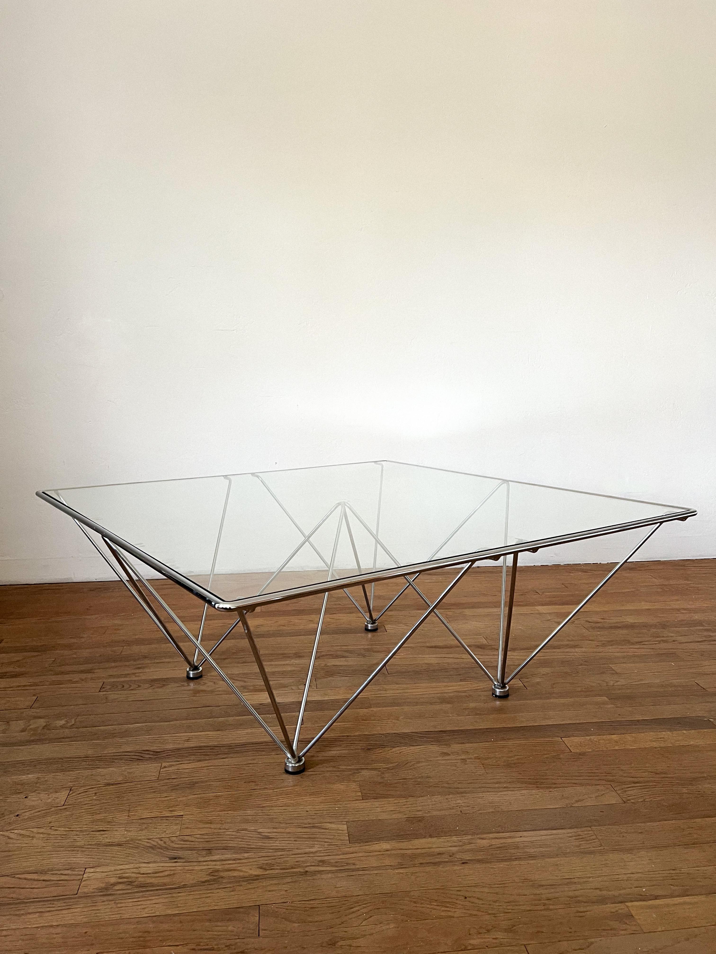 This phenomenal piece consists of a chrome sculptural frame that holds a glass top. This coffee table is modern and minimal for an airy effect but at the same time it carries the boldness of a statement piece. Produced in the manner of the “Alanda”