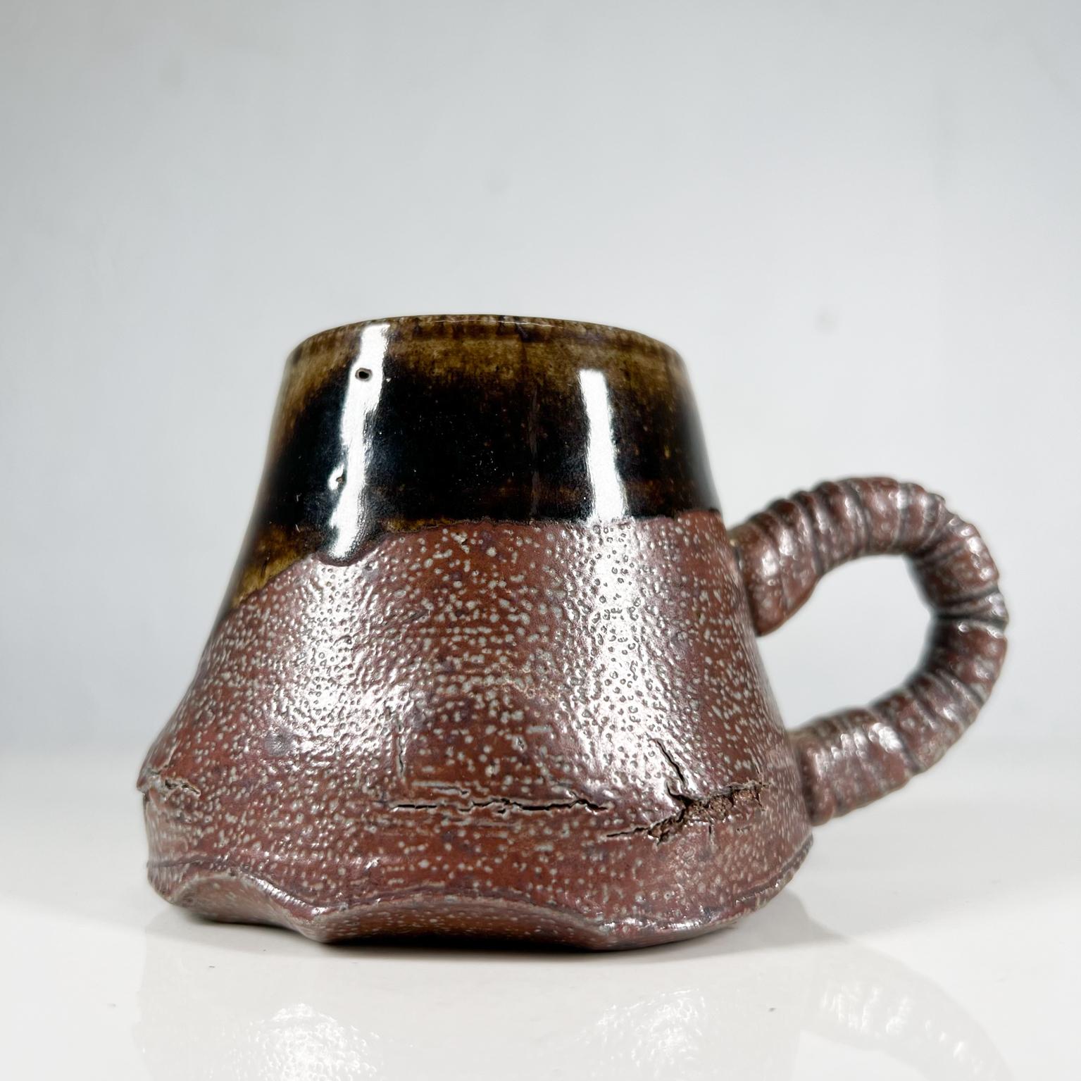 1980s sculptural dark brown mug coffee cup pottery art by Melching
Signed by artist
3 tall x 3.5 w x 5.13 d
Preowned unrestored vintage condition with wear.
Refer to images.