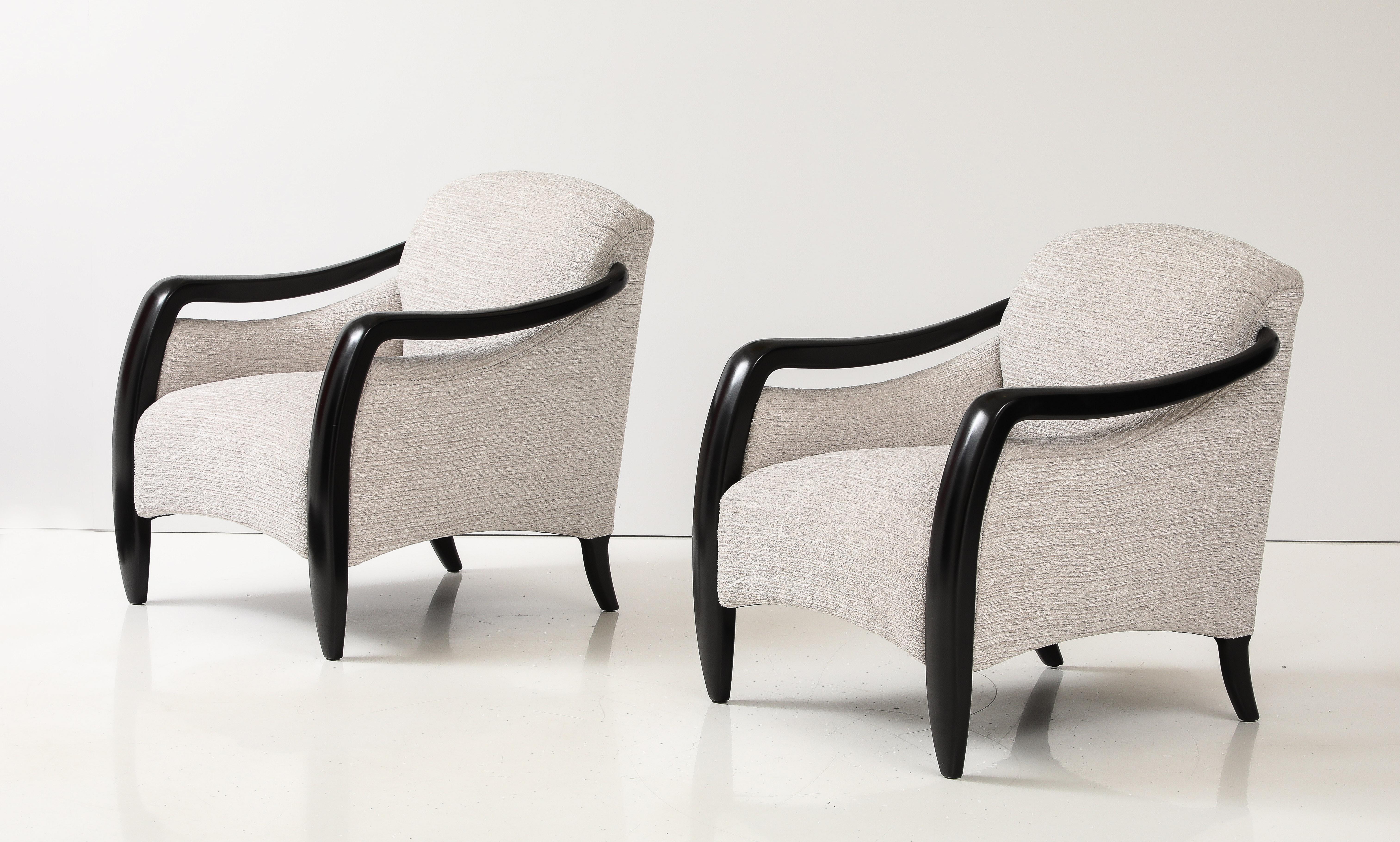 Amazing pair of 1980's sculptural modernist lounge chairs by Sam Moore, fully restored and lacquer in black with new Kravet fabric upholstery, with minor wear and patina due to age and use.