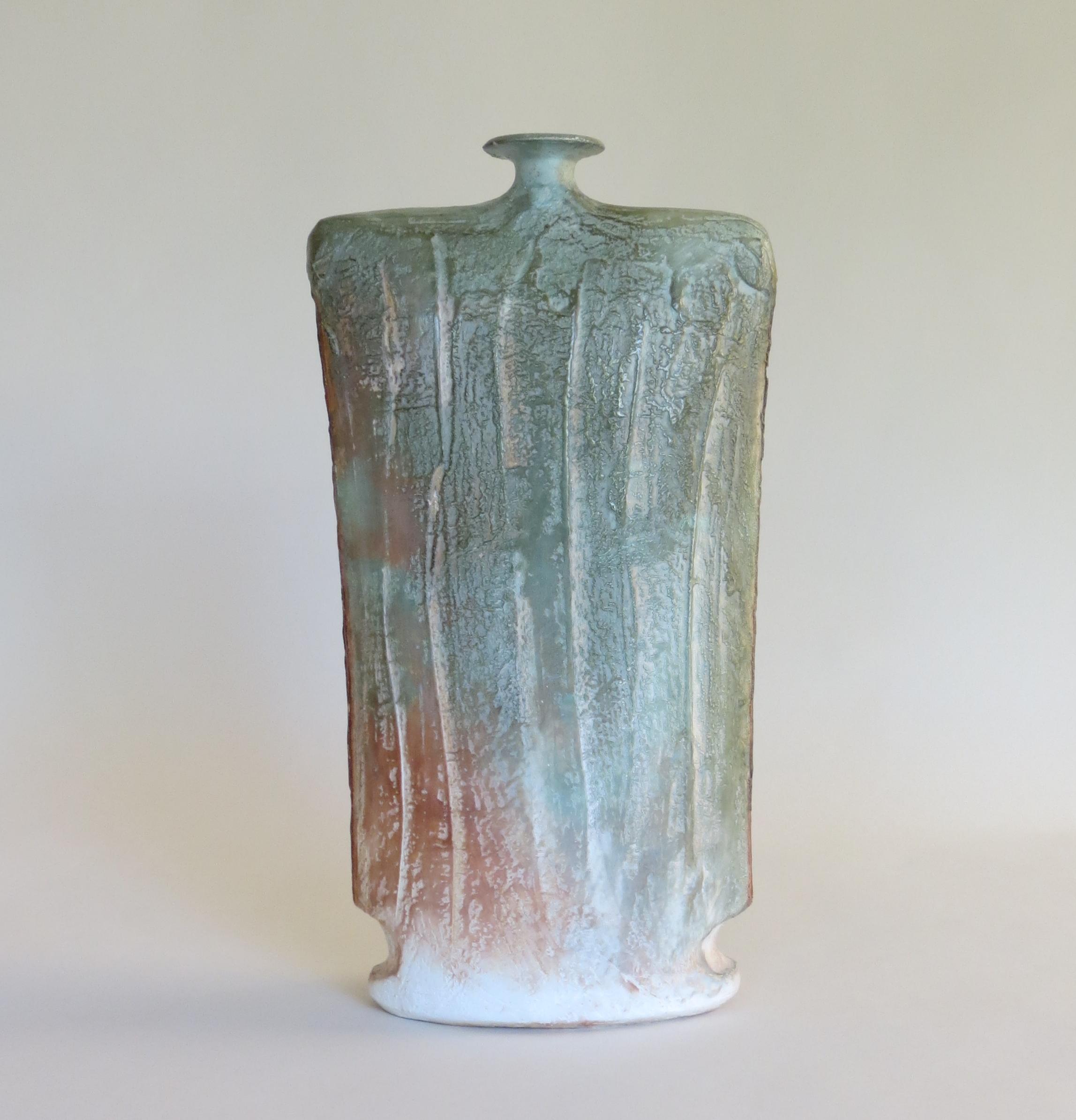 Handmade slab studio pottery vase in good condition.  This piece dates from the 1980s and is signed by the artist John Bedding who is based in St Ives.

In very good condition.