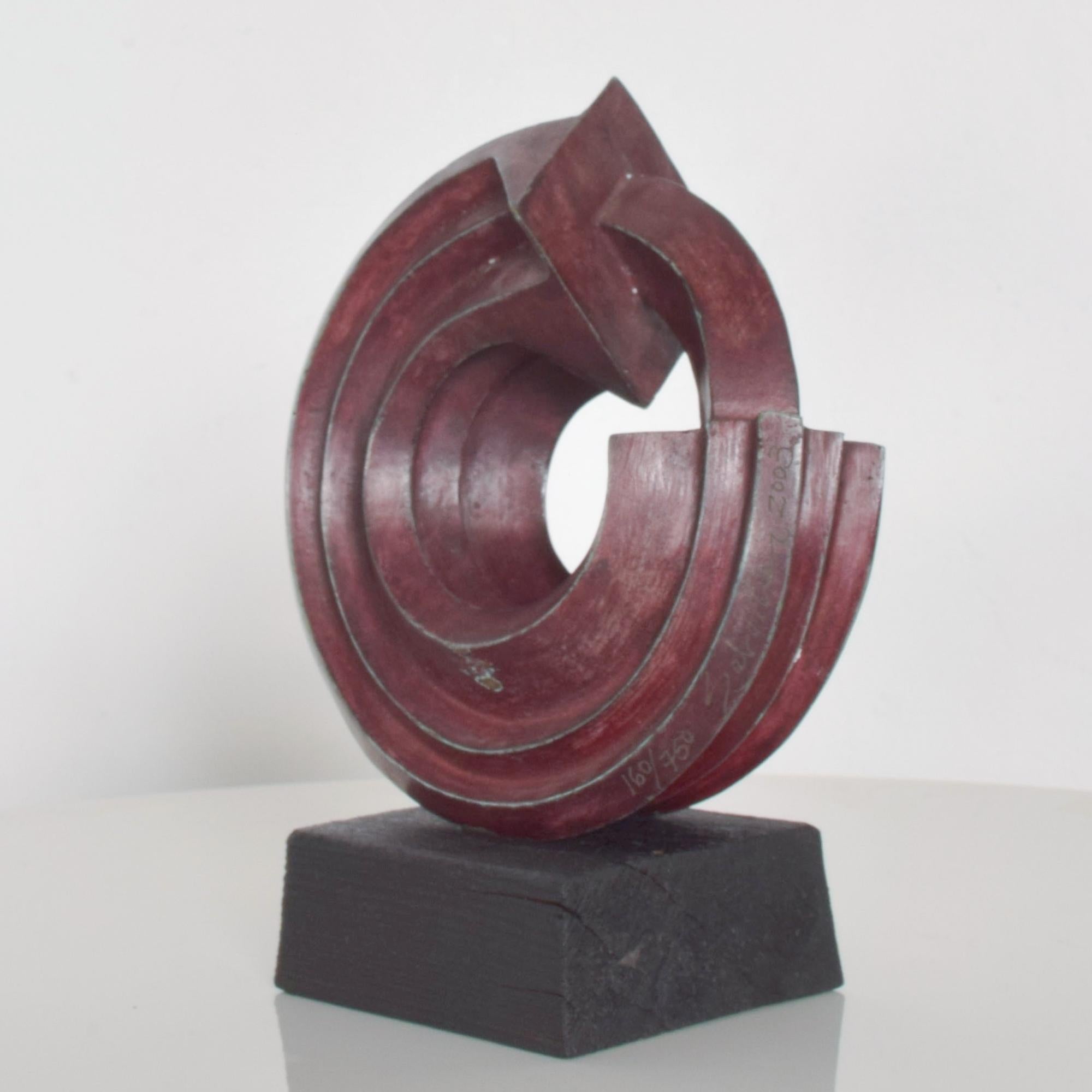 AMBIANIC presents:  Modern Abstract Sculpture by Sebastian the internationally known Sculptor born Enrique Carbajal González from Mexico. 
Sculpture signed by SEBASTIAN 2003, 160/750.
Patinated Bronze. Red Patina. Mounted on Teak Wood. 
Dimensions: