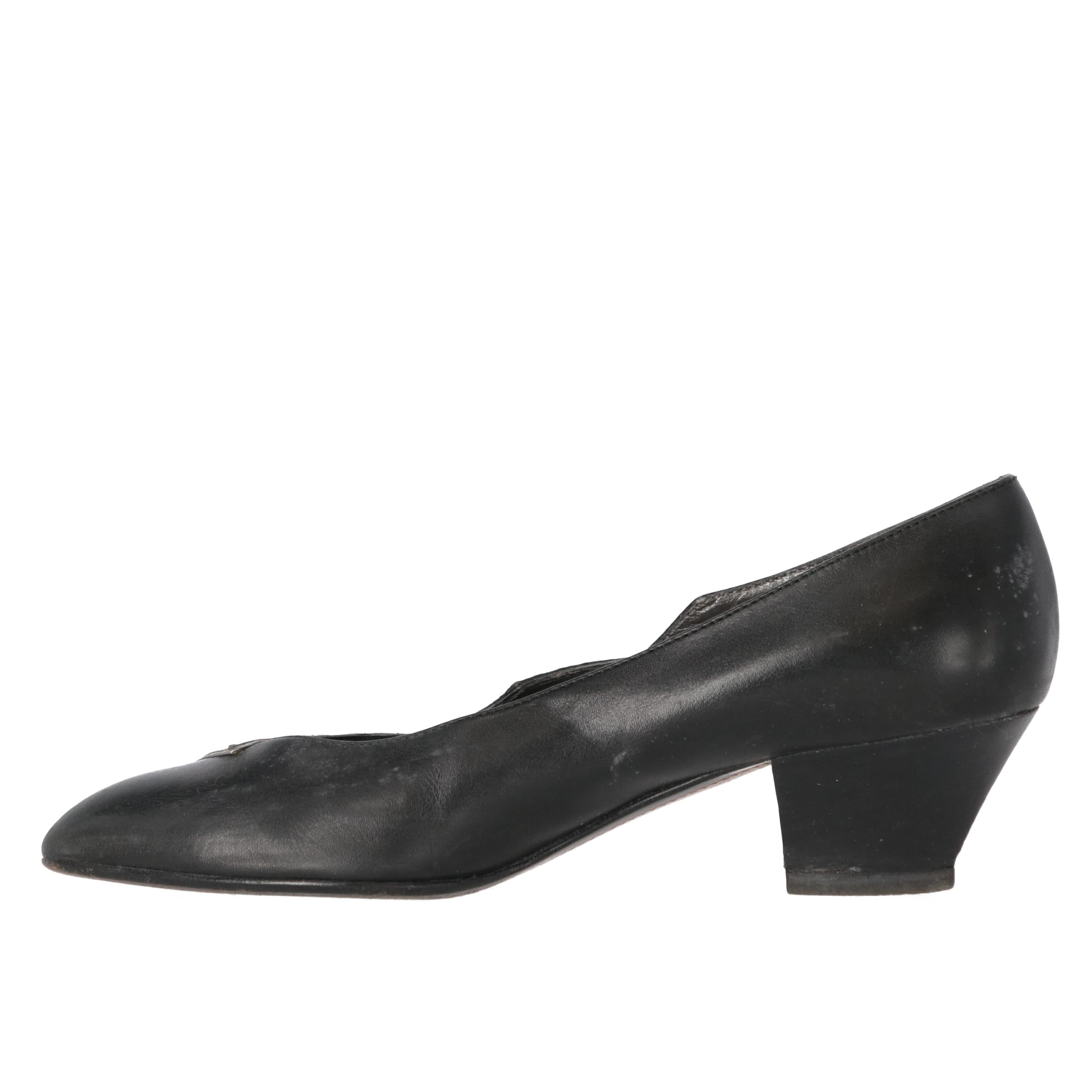 Sergio Rossi black genuine leather low-heeled pumps with contrasting printed black leather insert and silver hems. Pointed toe and silver-tone decorative small studs on the sides.

The item shows signs of wear on the leather and the sole, as shown