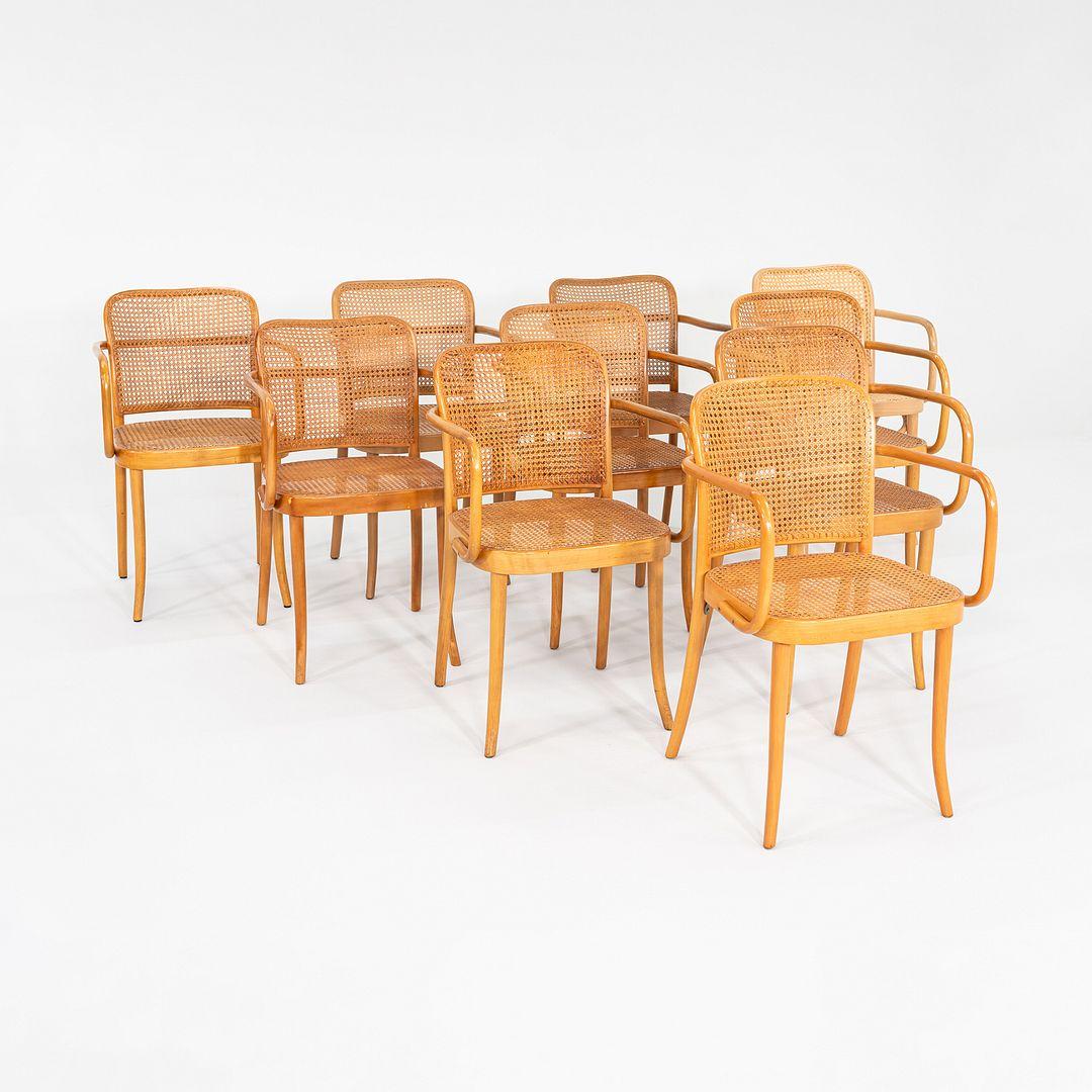 This is a spectacular Set of Ten Prague Chairs, Model No.311, initially designed by Austrian designers Josef Frank and Josef Hoffman for Thonet in the 1920's. This set dates to the 1980s. The chairs feature beechwood frames, and retain their