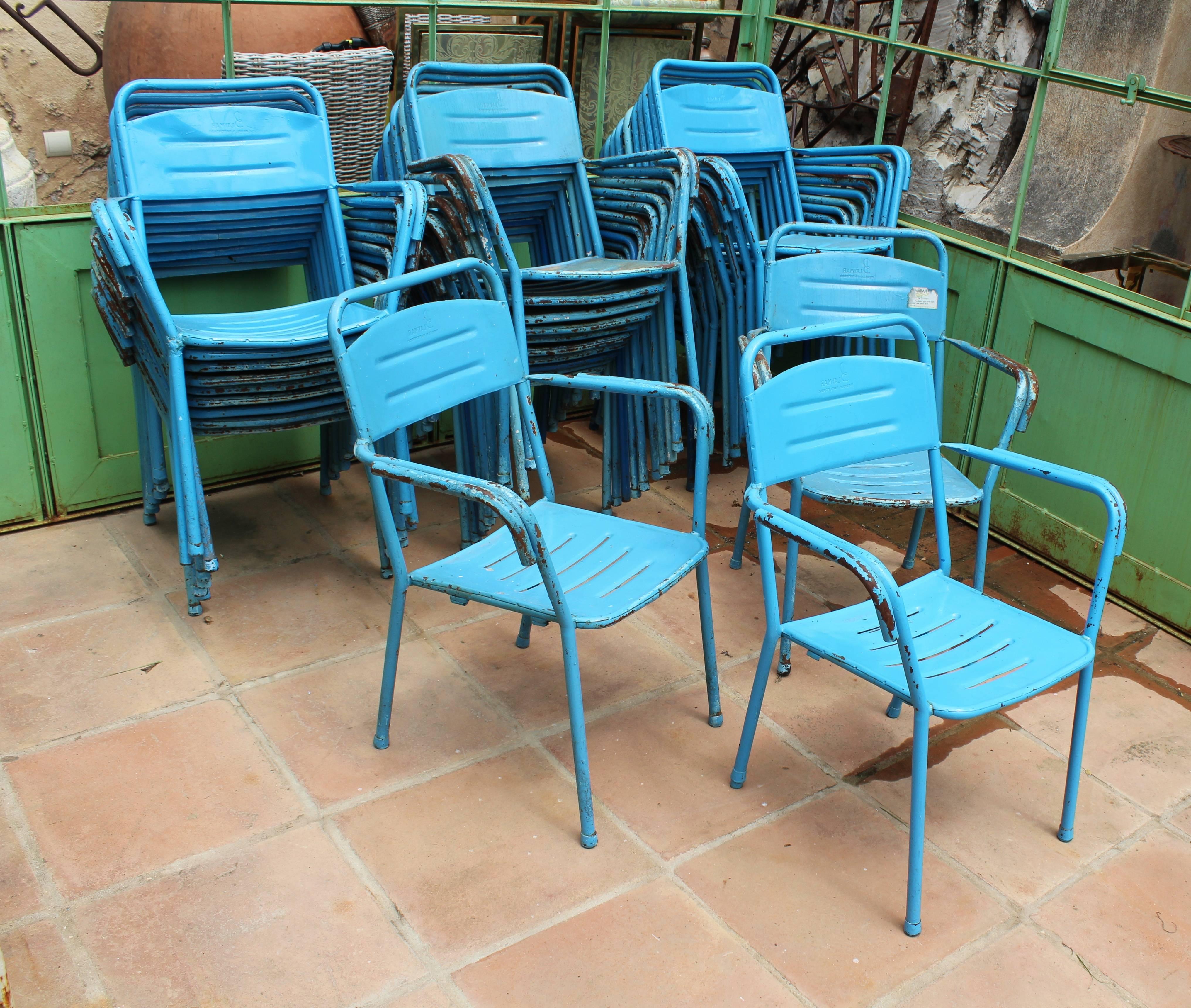 Set of 32 Spanish made iron chairs in their original blue color.