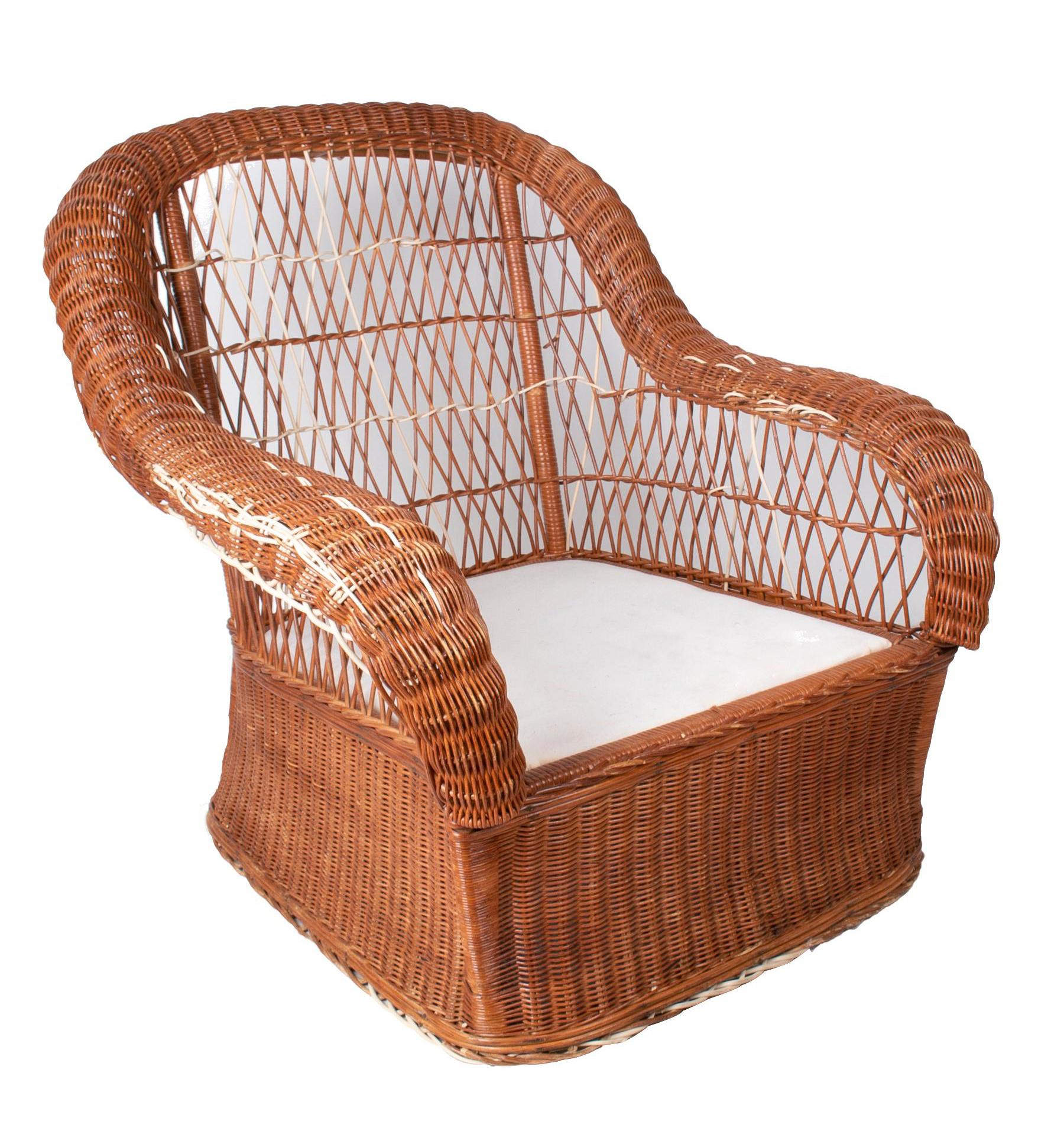 1980s set of four hand woven rattan garden armchairs.