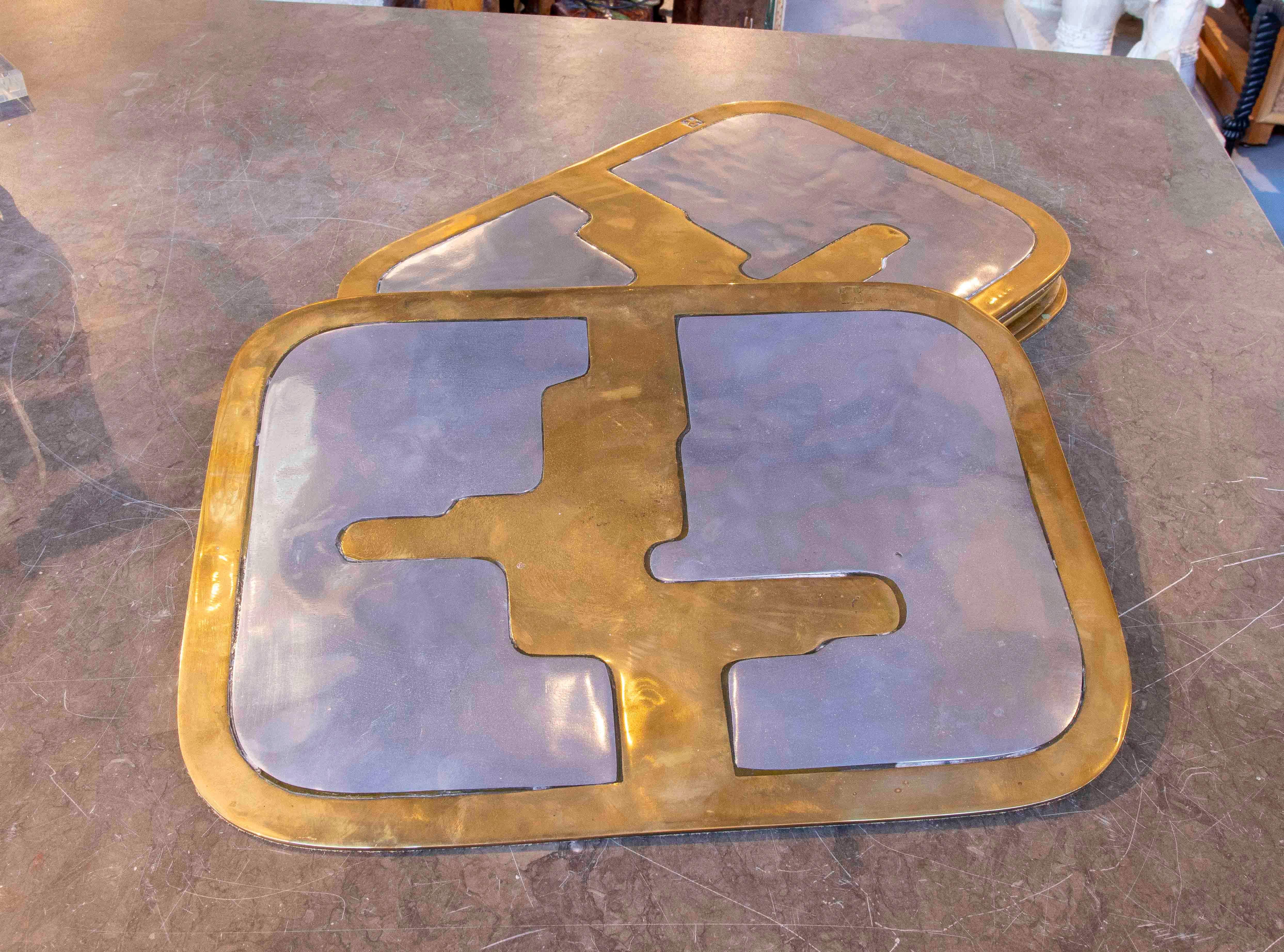 1980er Satz von sieben Untersetzern aus Messing und Aluminium von David Marshall, Spanien. (Spanisch) im Angebot