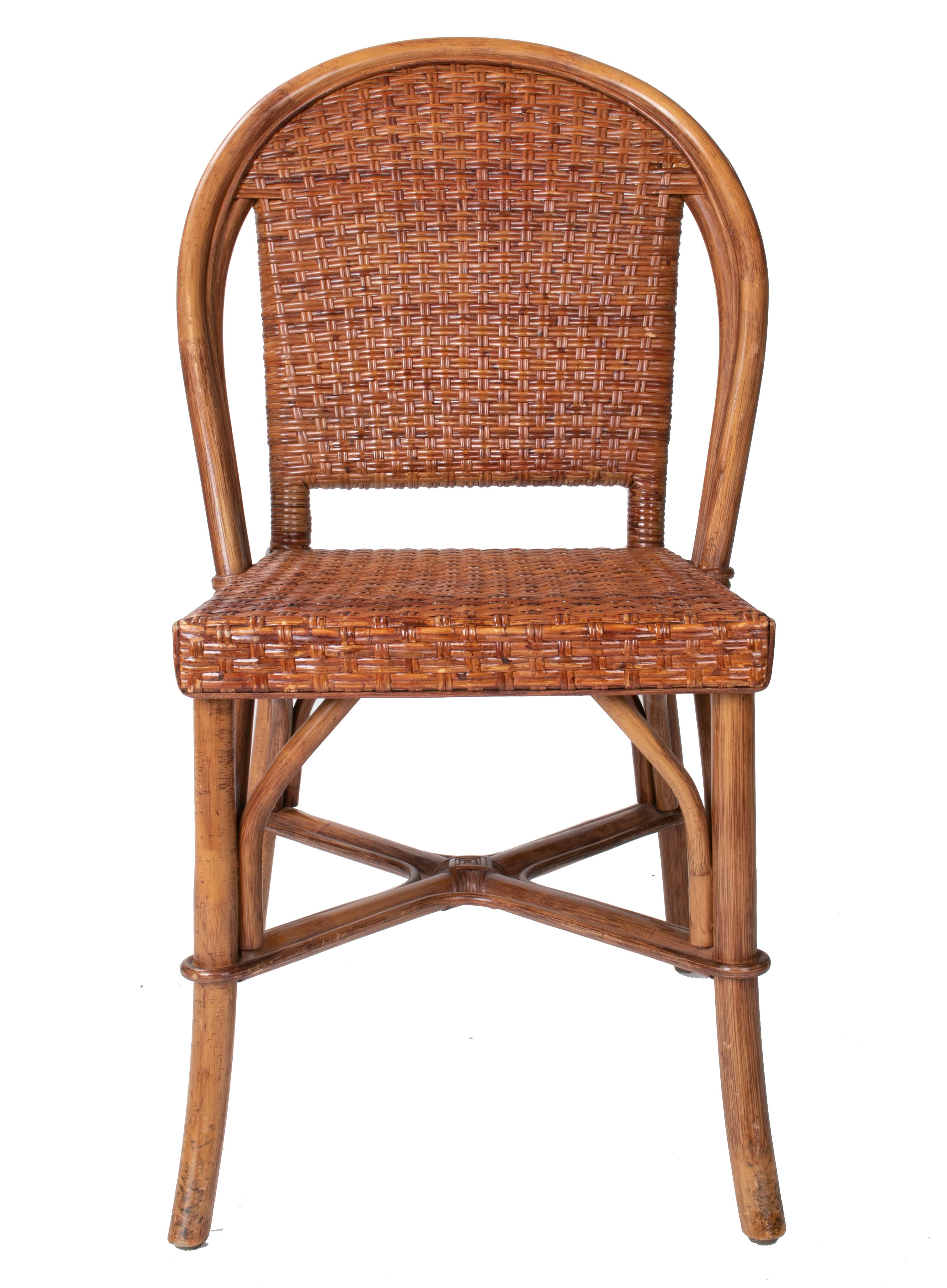 1980s set of six Spanish wicker and wood chairs.