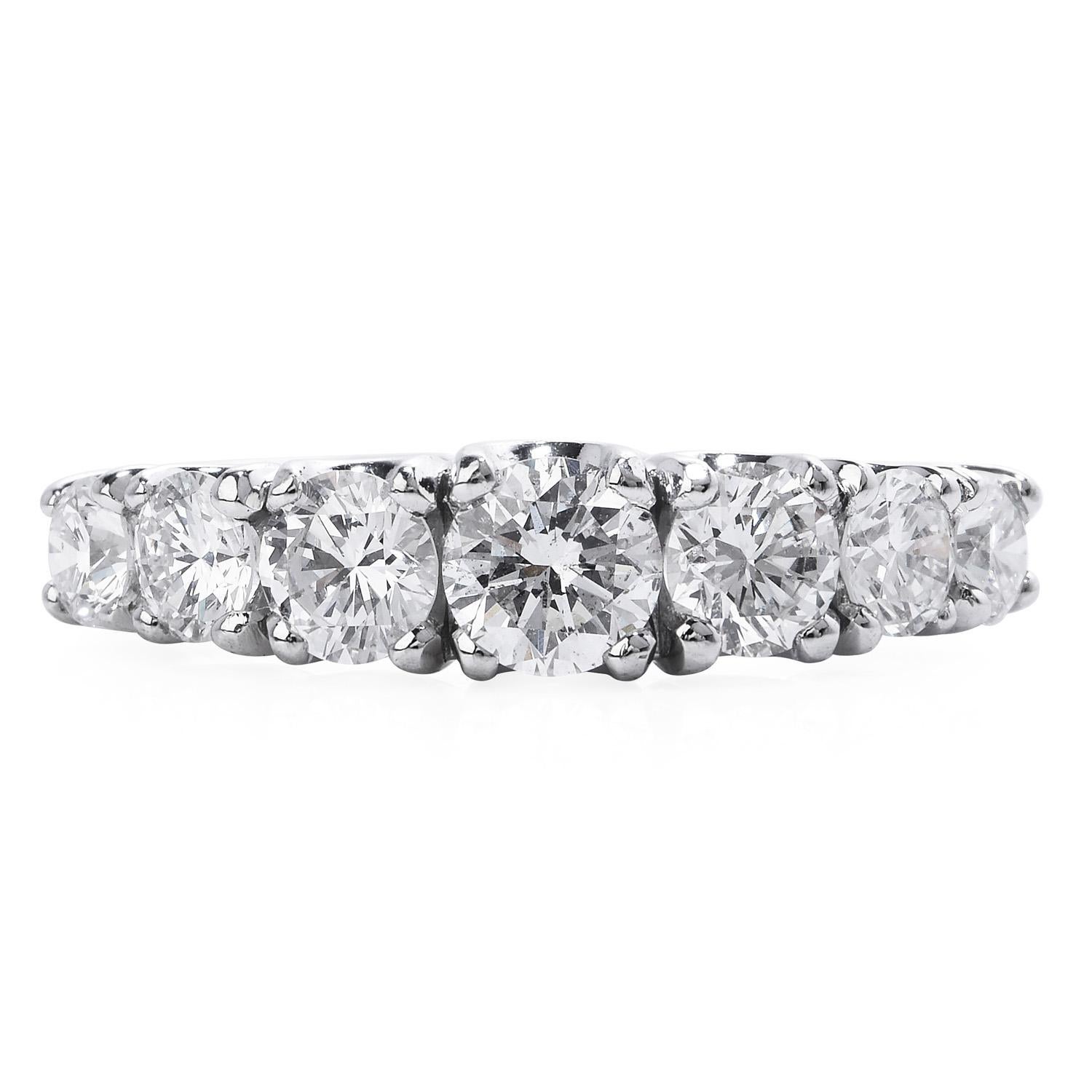 This enchanting diamond band ring is crafted in solid Platinum and is adorned with 7 genuine round cut Diamonds of approx: 1.45 carats, VS2 Clarity, G-H Color, Prong setting.

Featuring a polished finish, this lovely band ring remains in excellent
