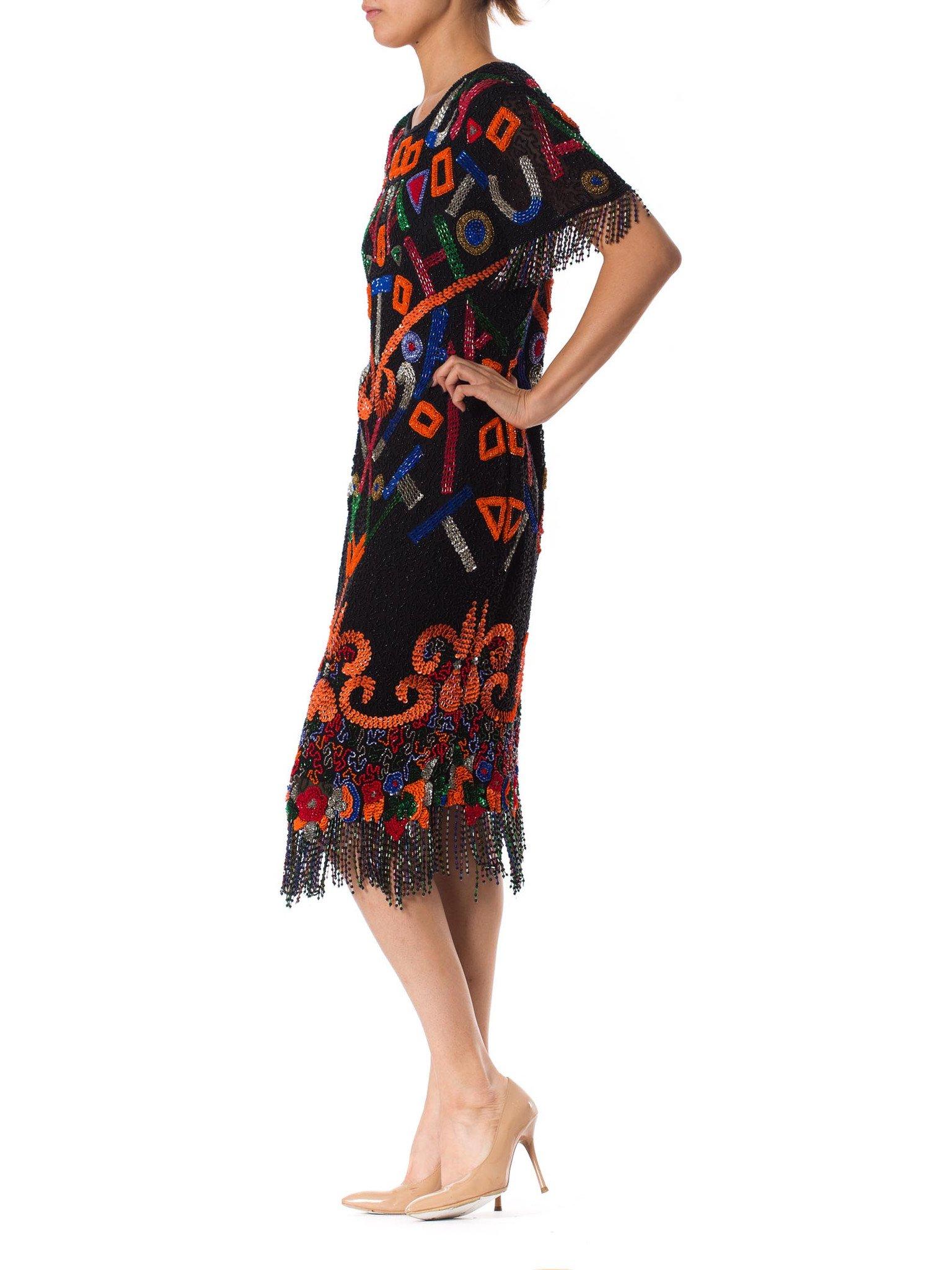 1980S  Black Beaded Silk Chiffon Tribal Inspired Cocktail Dress With Fringe Hem & Cut Out Back
