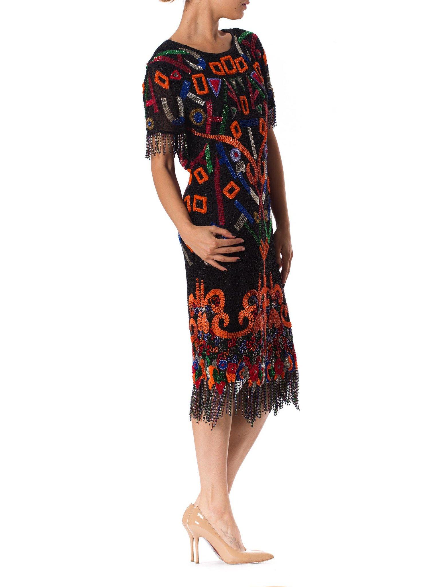 Women's 1980S  Black Beaded Silk Chiffon Tribal Inspired Cocktail Dress With Fringe Hem For Sale