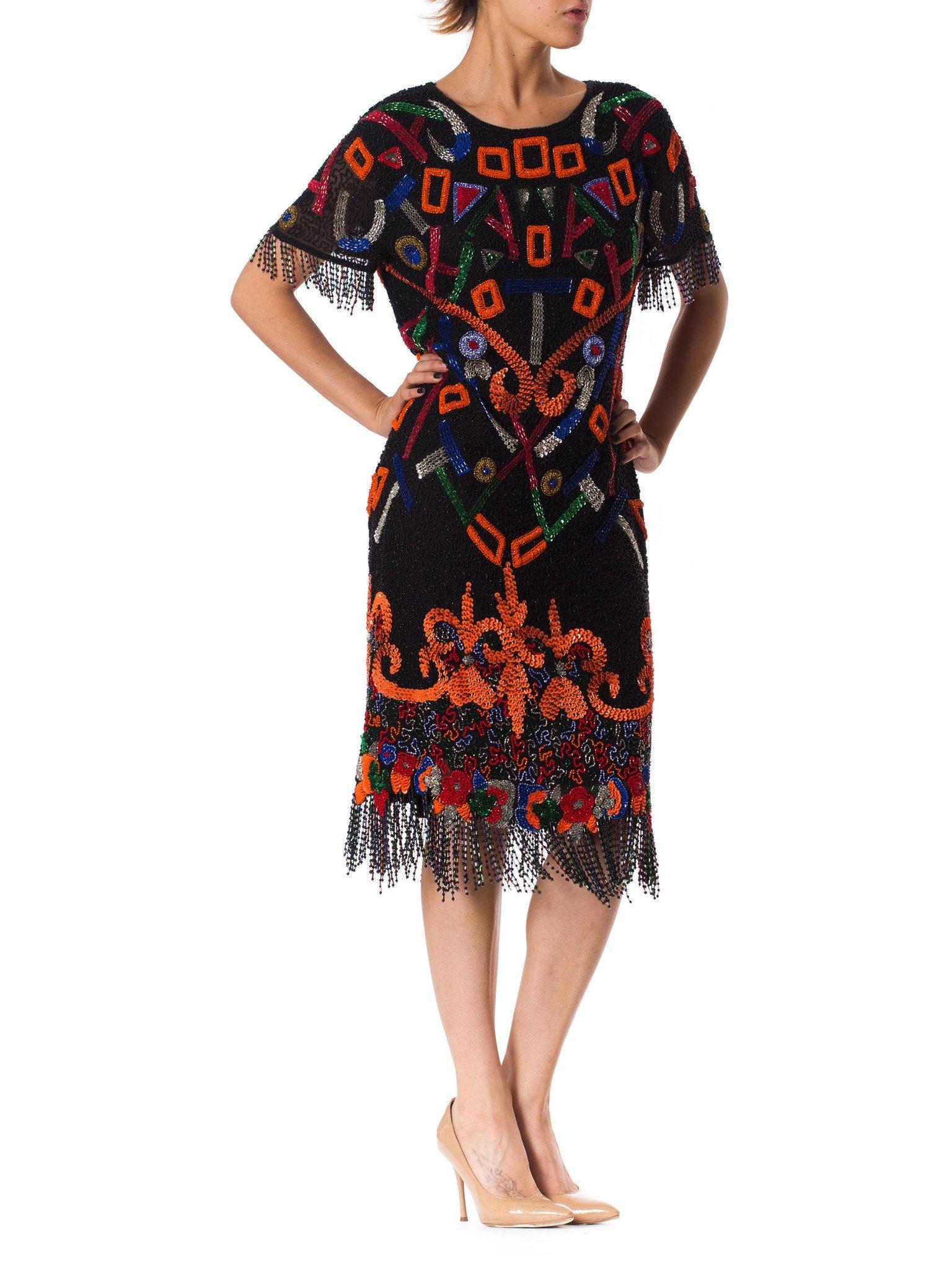1980S  Black Beaded Silk Chiffon Tribal Inspired Cocktail Dress With Fringe Hem For Sale 1