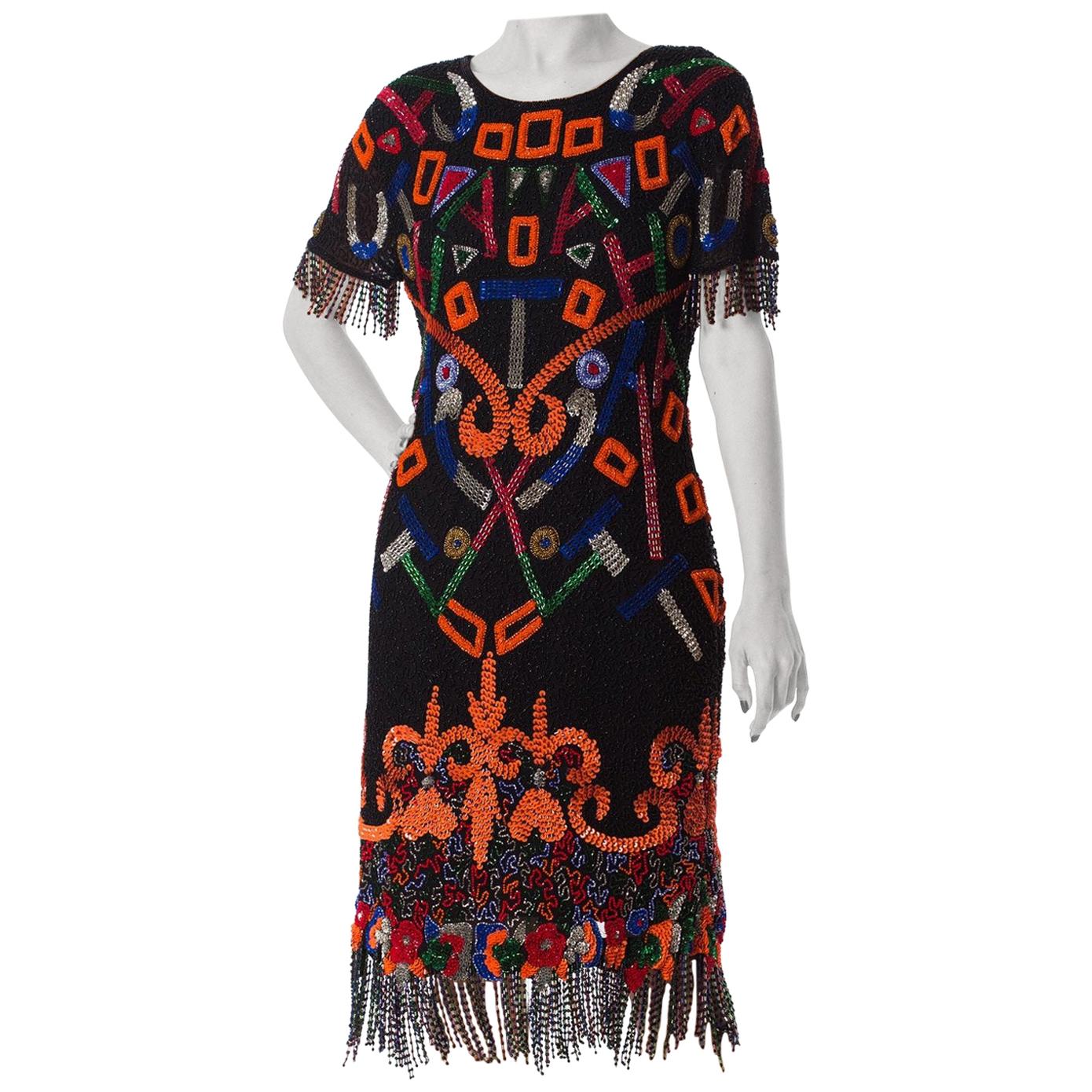1980S  Black Beaded Silk Chiffon Tribal Inspired Cocktail Dress With Fringe Hem For Sale