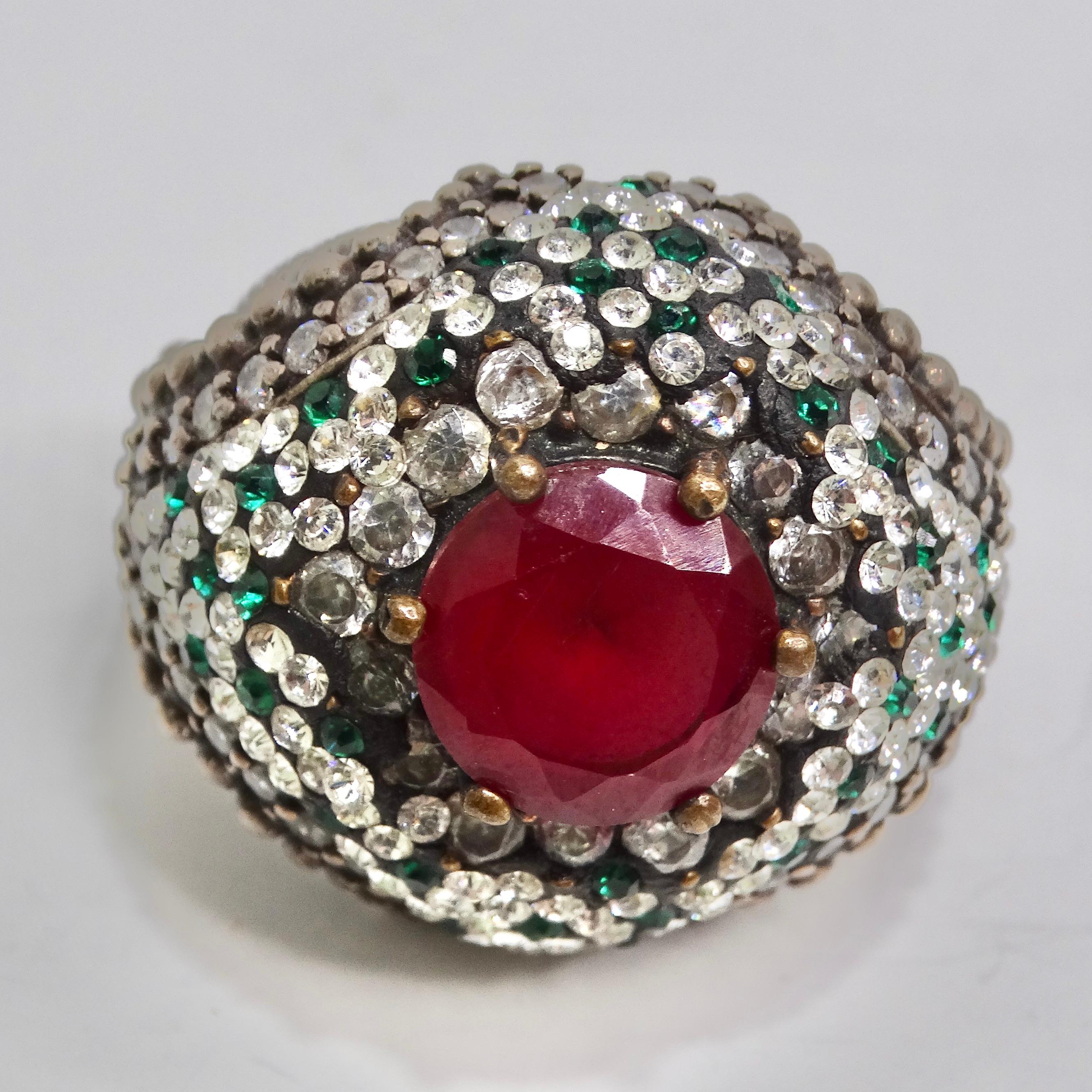 Introducing our sensational 1980s Silver 925 Synthetic Ruby Ring, a dazzling and glamorous piece that embodies the bold and extravagant style of the 1980s. Crafted with meticulous attention to detail, this ring is a true statement cocktail ring that