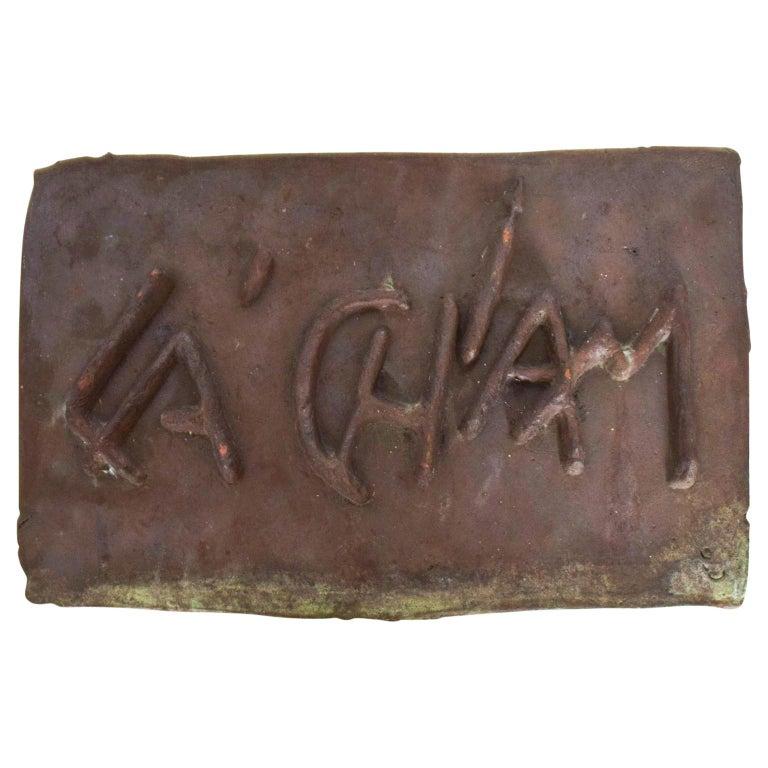 1980s Bronze Wall Art abstract Sculpture L'Chaim La Chaim Solid Bronze Plaque 
To Life Good Luck
Made in solid bronze heavy sculpture. 
No hardware included.
Unmarked.
8.75H x 14W x .5 D inches
Preowned original unrestored vintage condition 
Refer