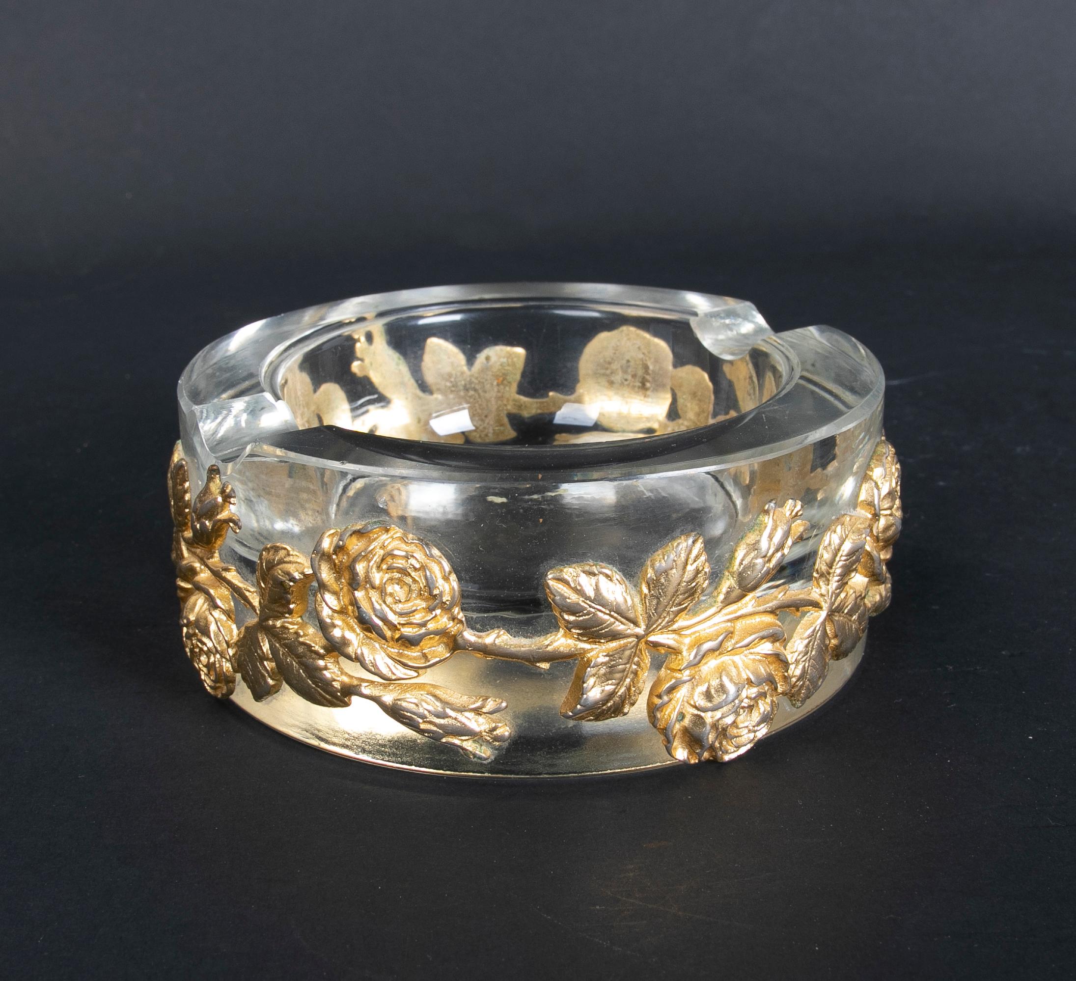 1980s solid glass ashtray with bronze flowers decoration.
