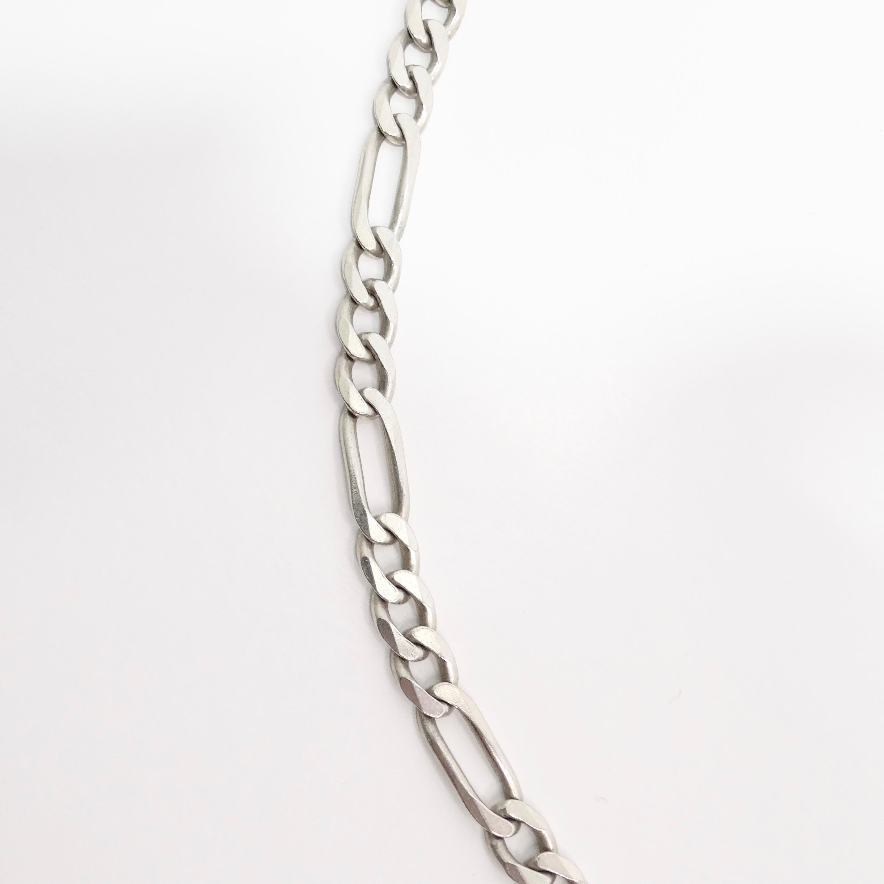 Introducing the 1980s Solid Silver Miami Link Chain Necklace, a timeless and versatile piece that captures the essence of classic style. This vintage necklace features a shiny silver Miami-style link chain, known for its bold yet elegant