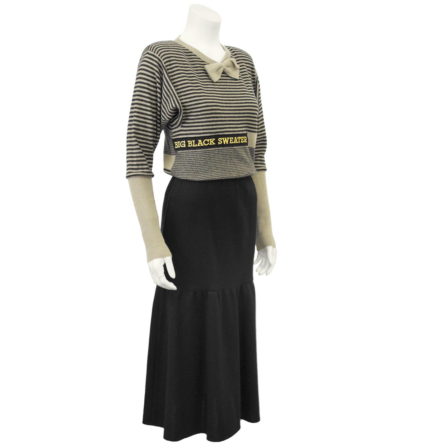 Sonia Rykiel black knit skirt and beige and black striped sweater ensemble from the 1980s. The sweater has variegated beige and black horizontal strips across the body and upper arms with solid beige ribbed cuffs and bows at the neckline and at the