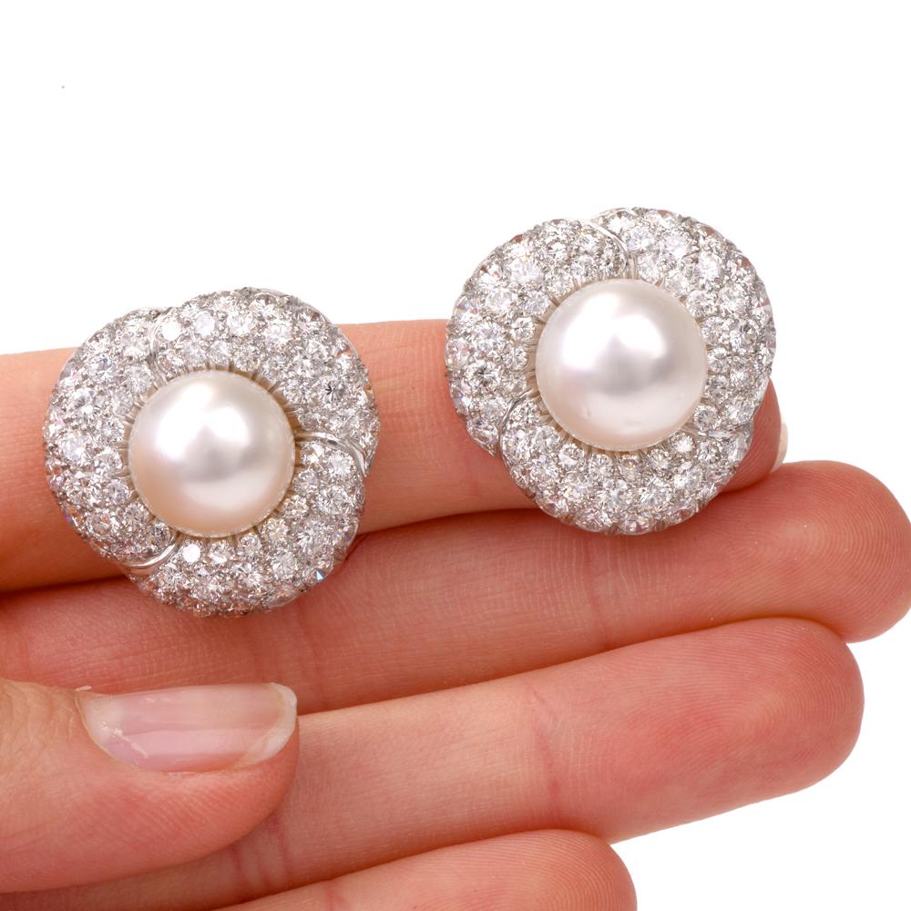 These stunning earrings of stylized floral design are crafted in solid platinum weighing 18.0 grams and measuring 25mm wide. Inspired by the opulent Retro earrings, they expose each a lustrous South Sea pearl measuring approx. 12mm in diameter of an