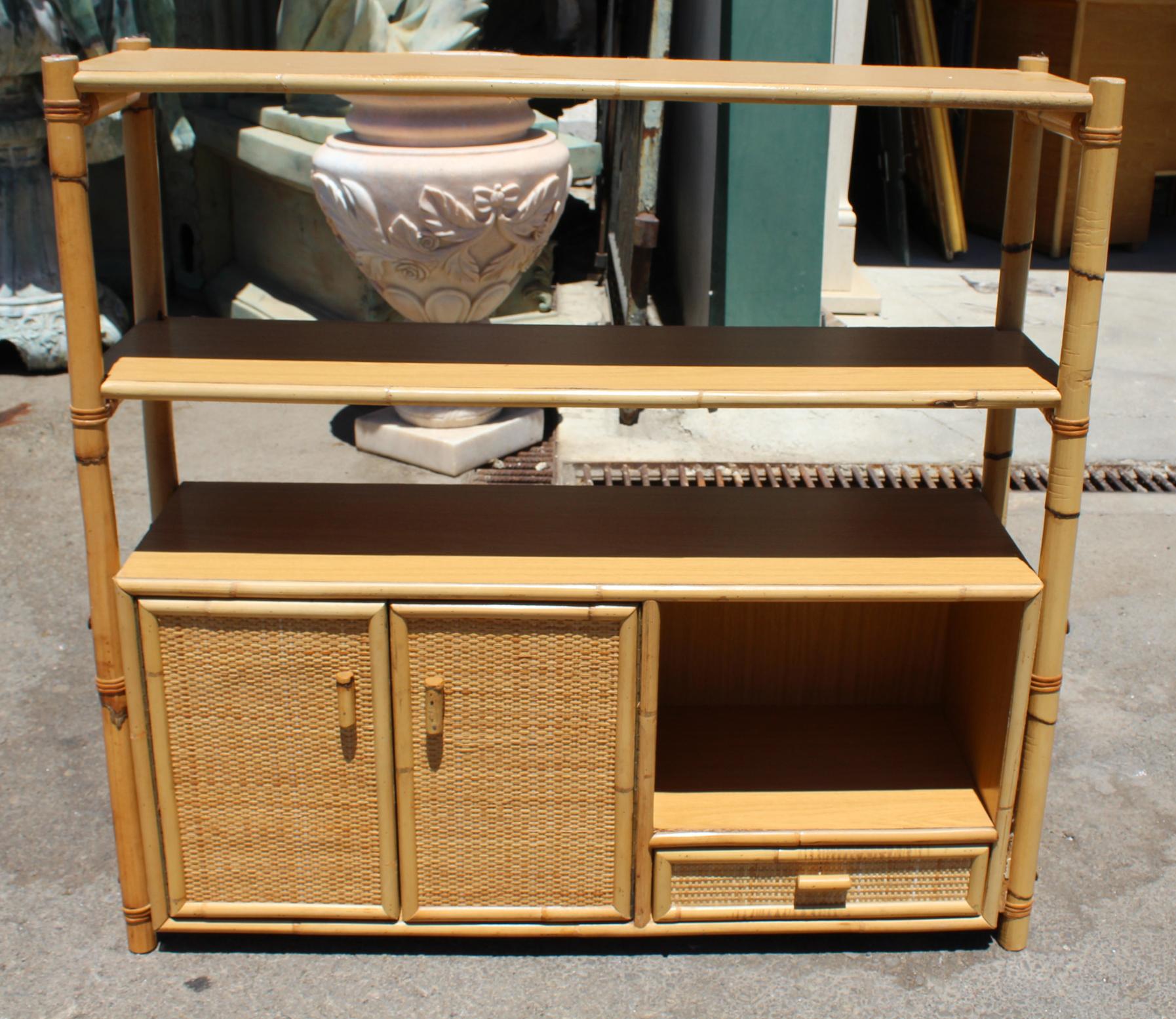 1980s Spanish bamboo and rattan bookshelf with drawers. 

 