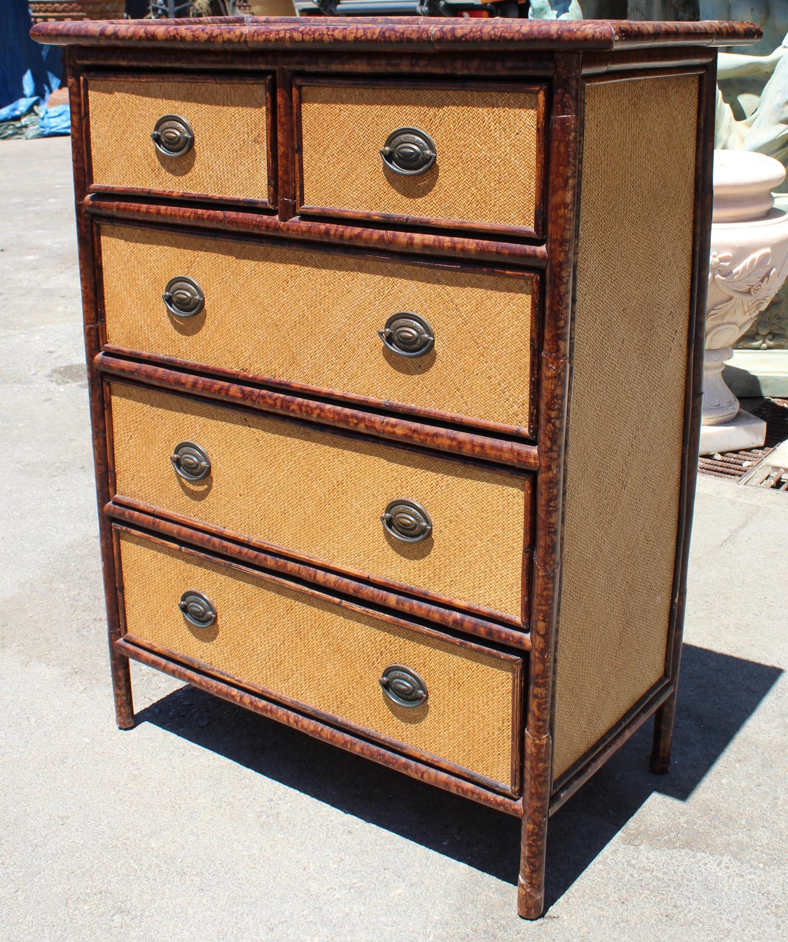 1980s Spanish bamboo and rattan chest of five drawers with iron handles.