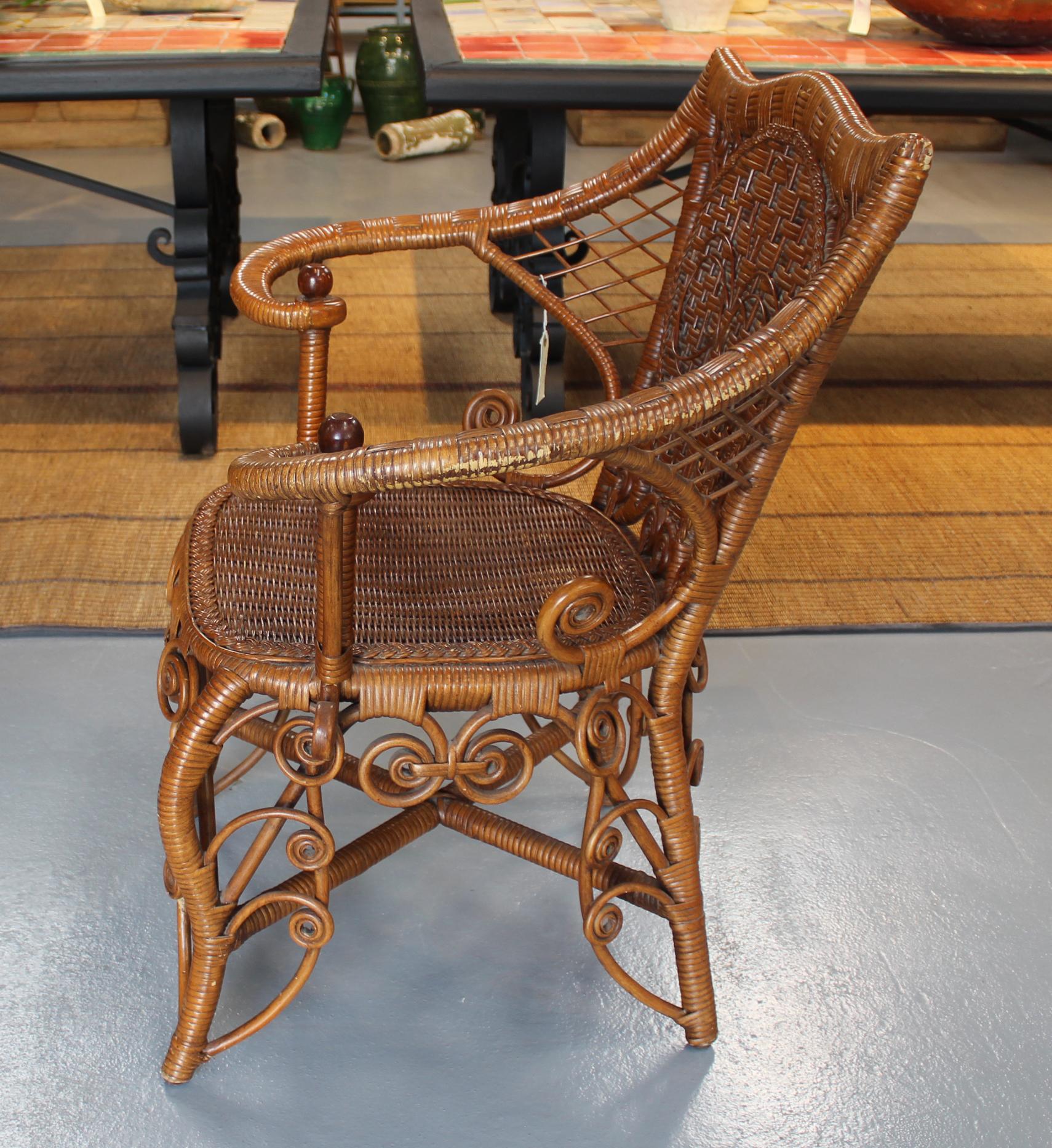 1980s Spanish canework and wood armchair with volutes decoration.