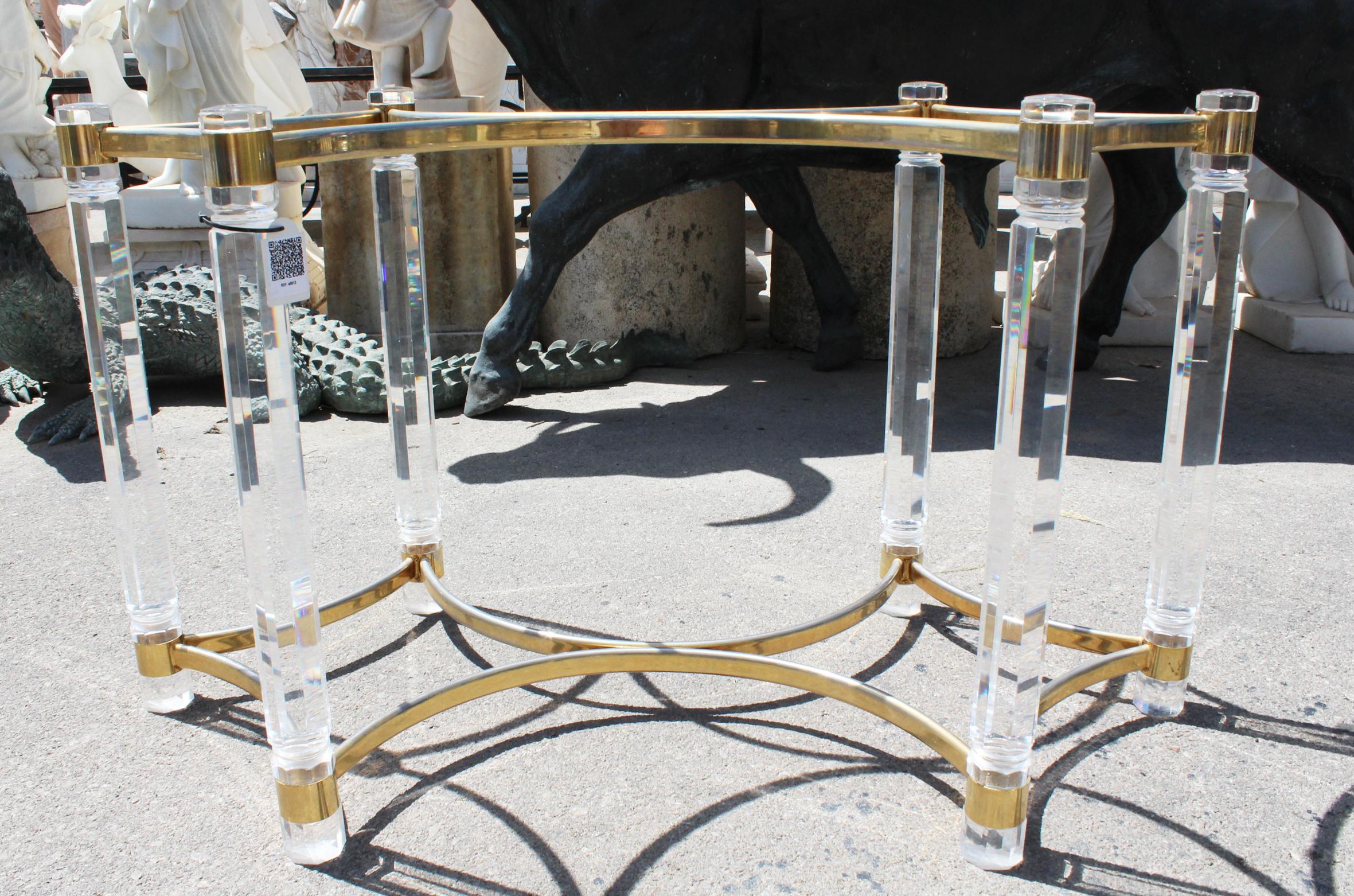 1980s Spanish dining table with methacrylate feet joined with gilded brass.
 