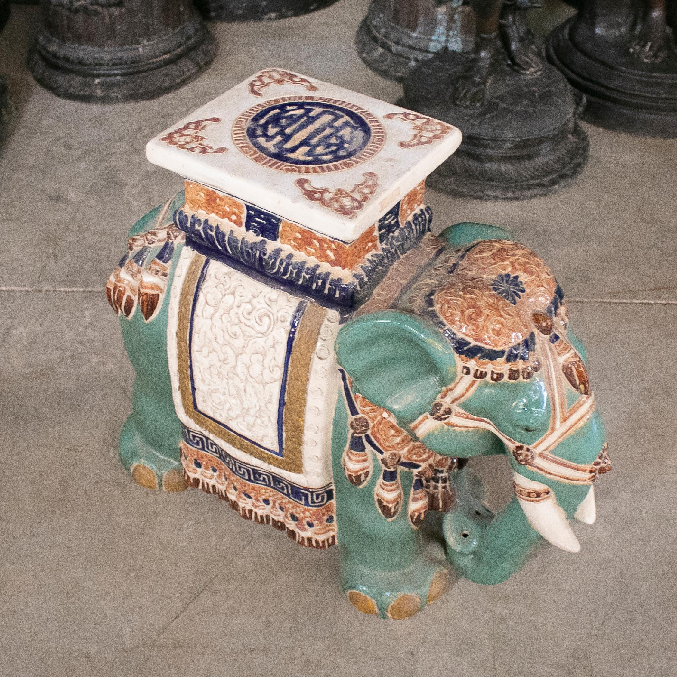 Vintage 1980s Spanish white, green an blue glazed ceramic painted elephant pedestal.
