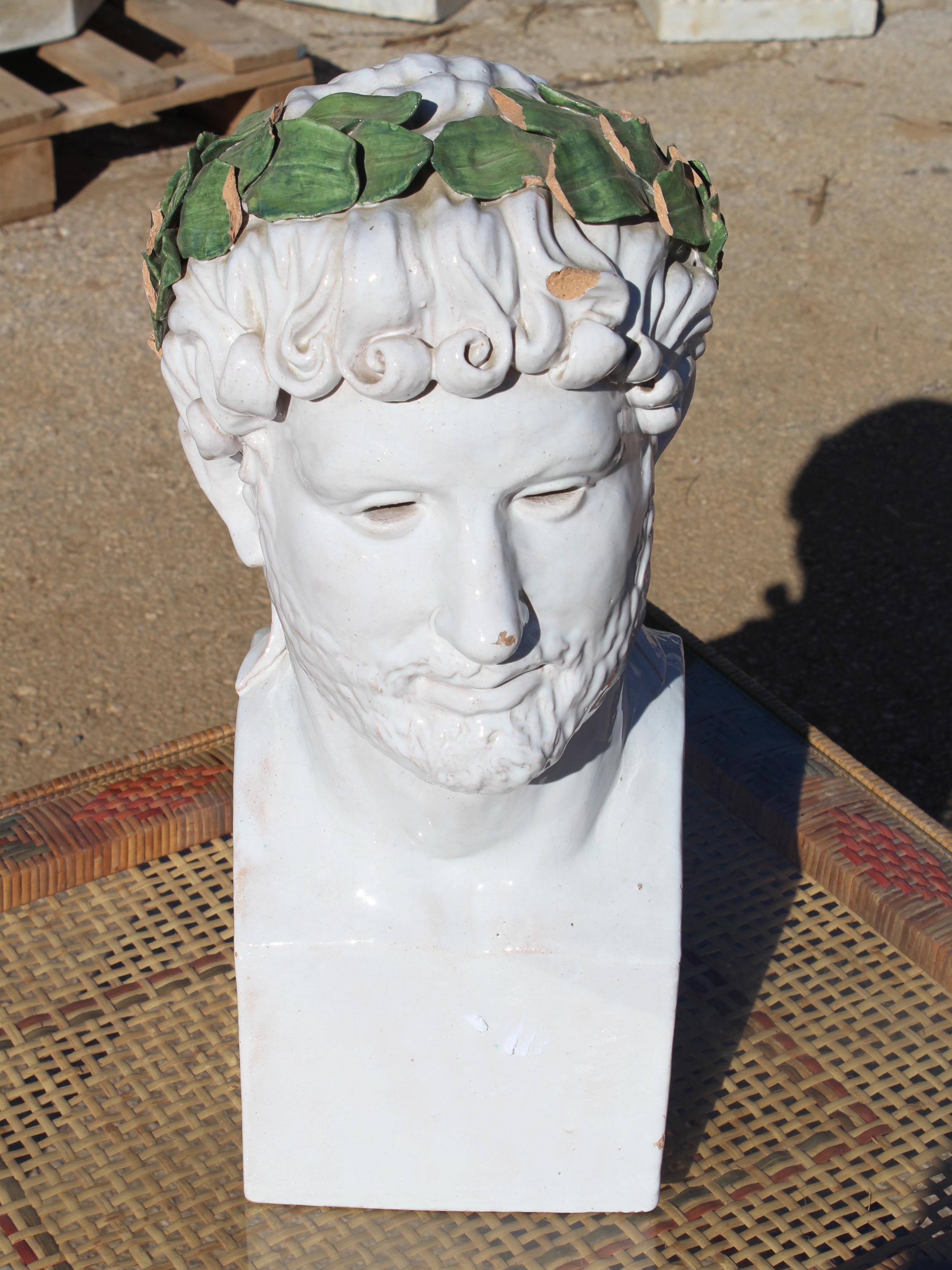 1980s Spanish white glazed terracotta bust of Roman emperor Adrian, crowned with a green laurel leaf wreath.

   