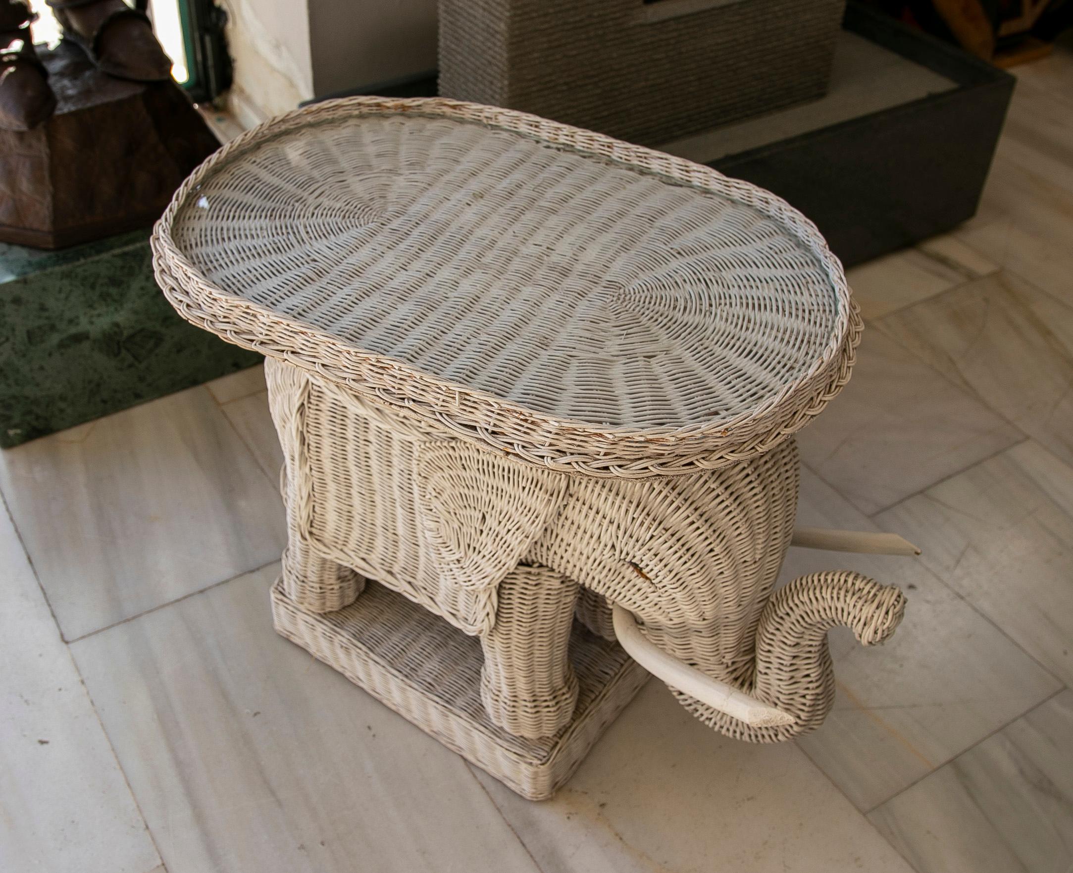 1980s Spanish hand woven wicker elephant pedestal table painted white.
