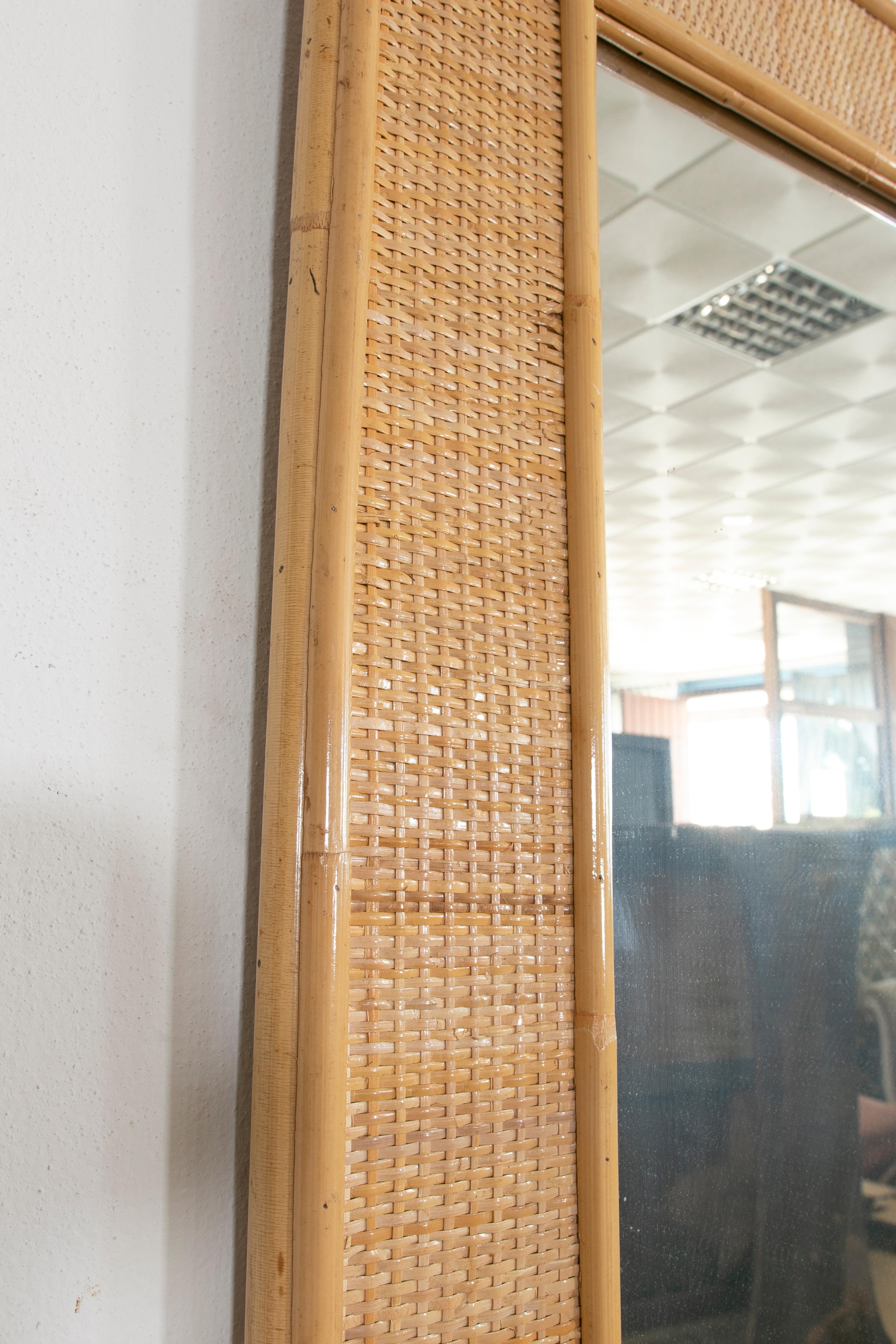 1980s Spanish pair of bamboo and wicker mirrors.