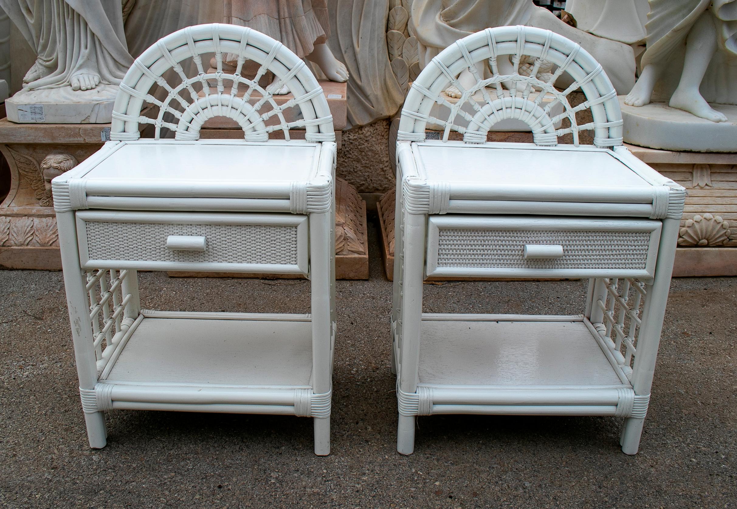1980s Spanish pair of bamboo and wicker white bedside tables.