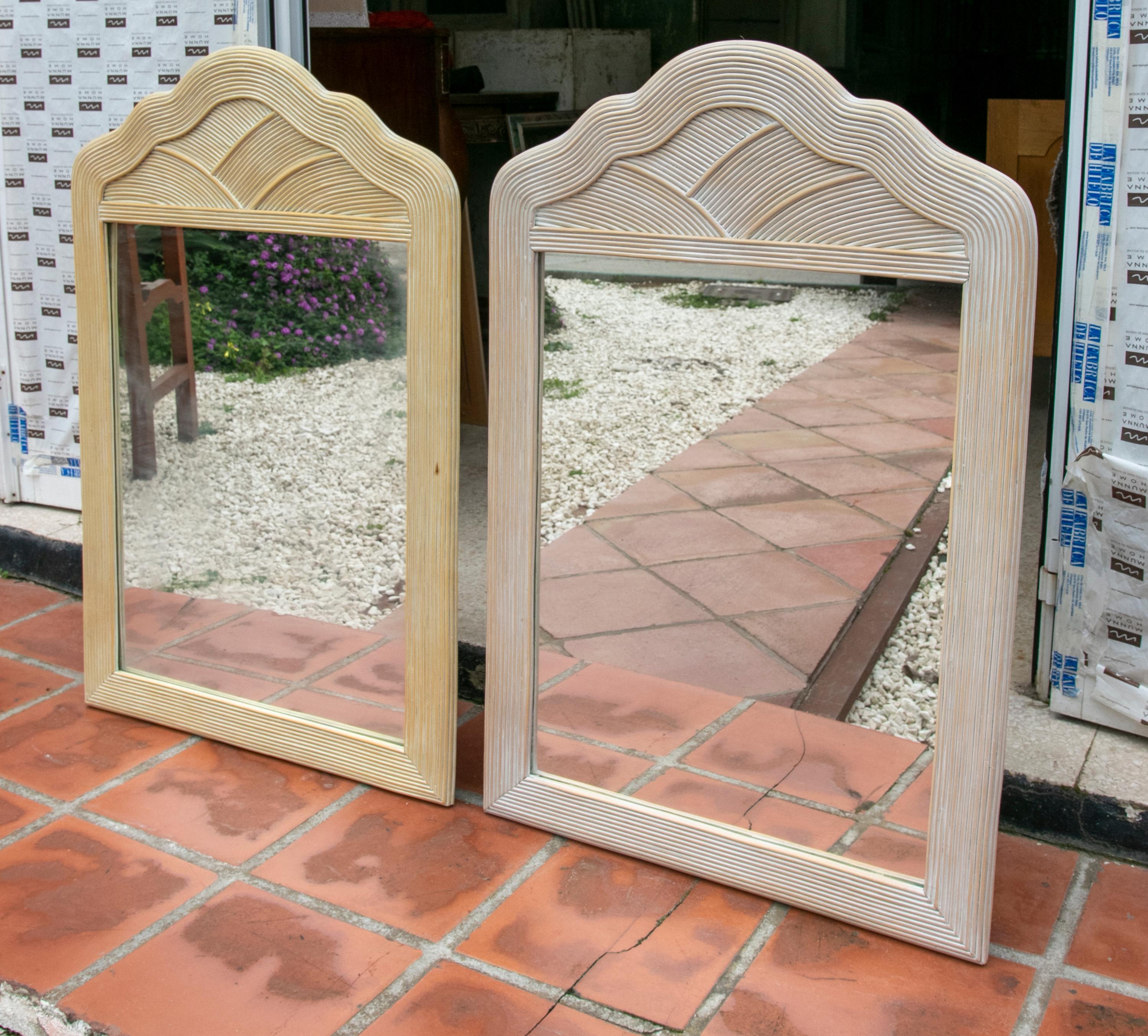 1980s Spanish pair of wicker mirrors.