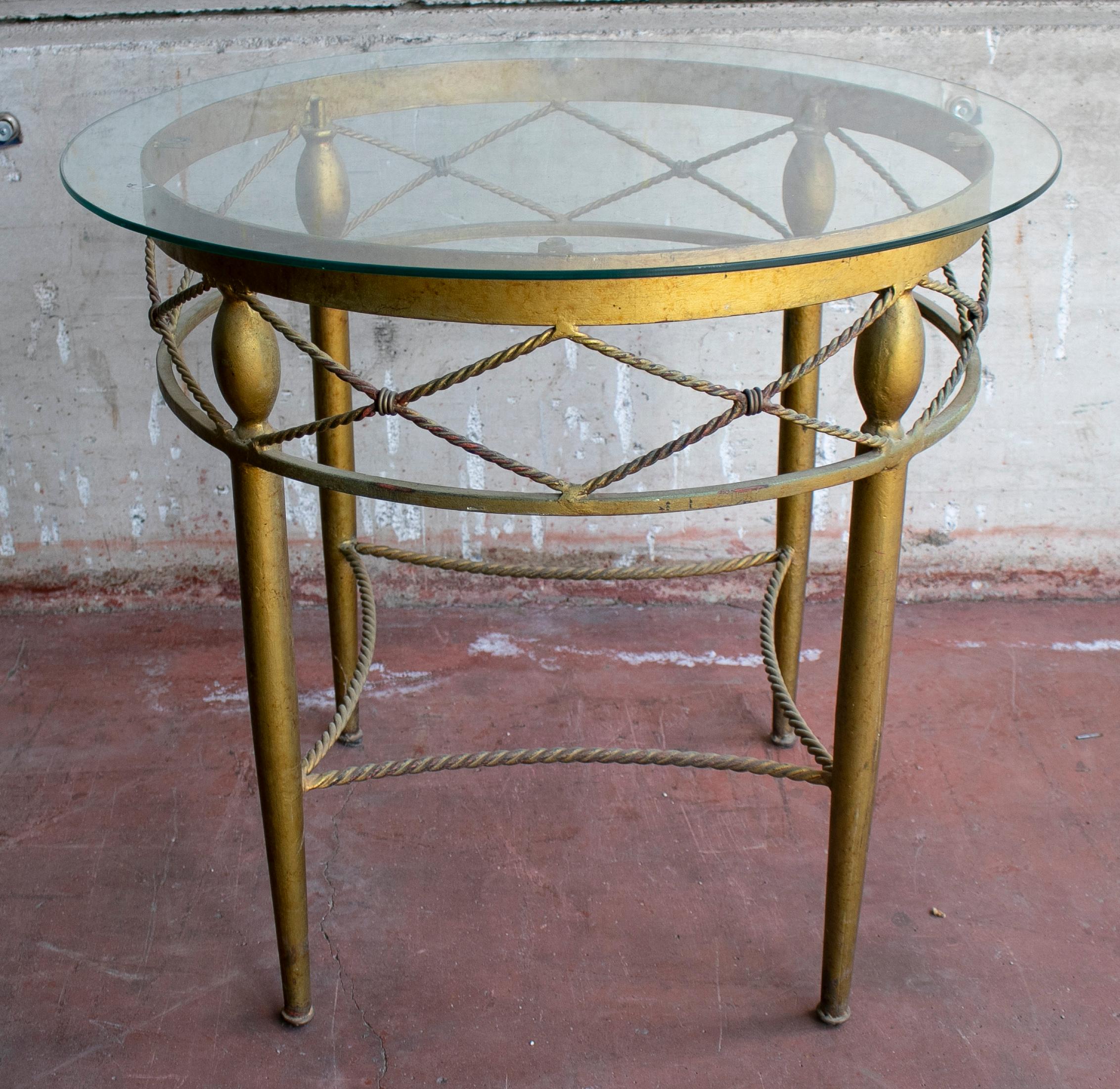 1980s Spanish round crystal top iron side table.