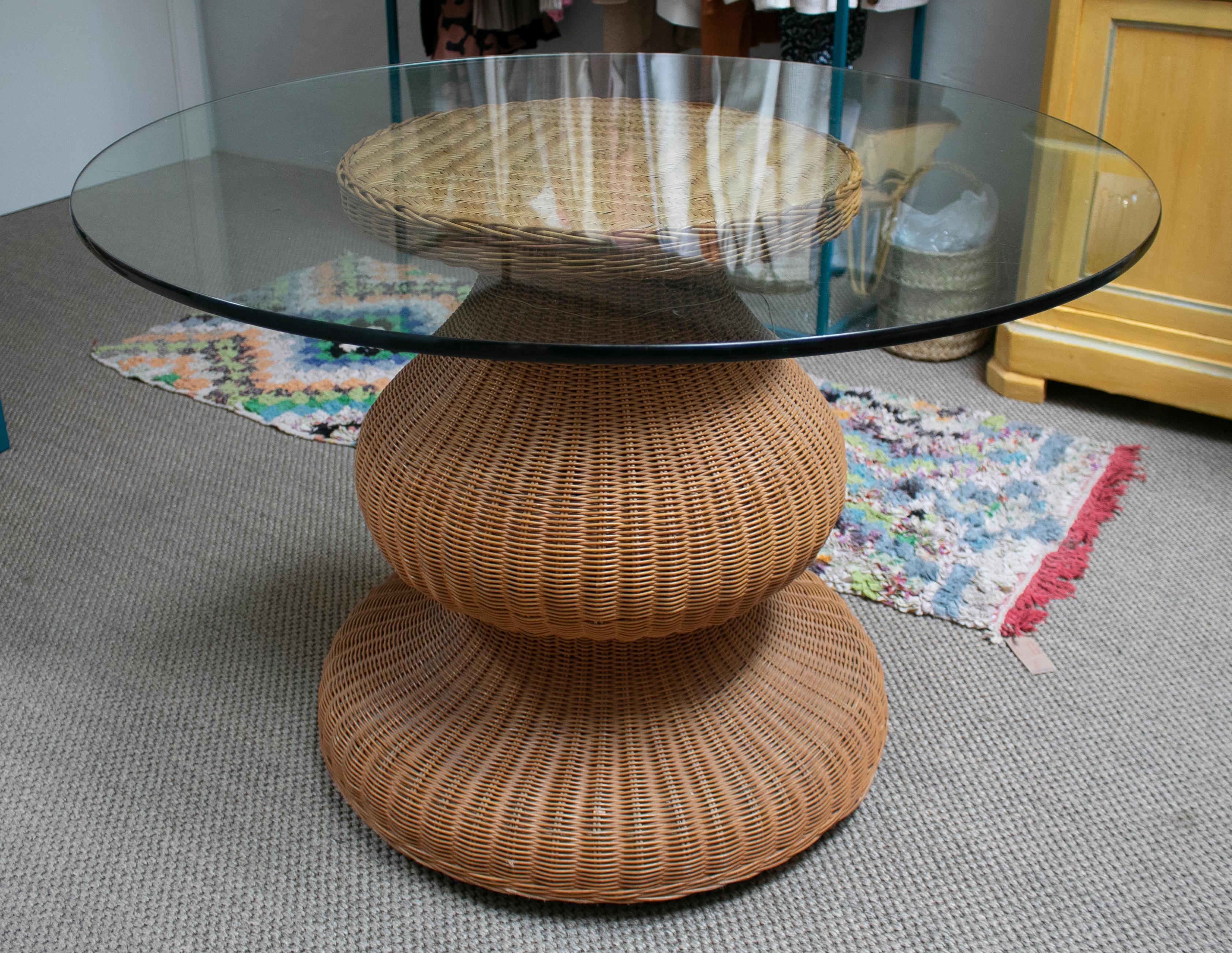 1980s Spanish round wicker table with glass top.