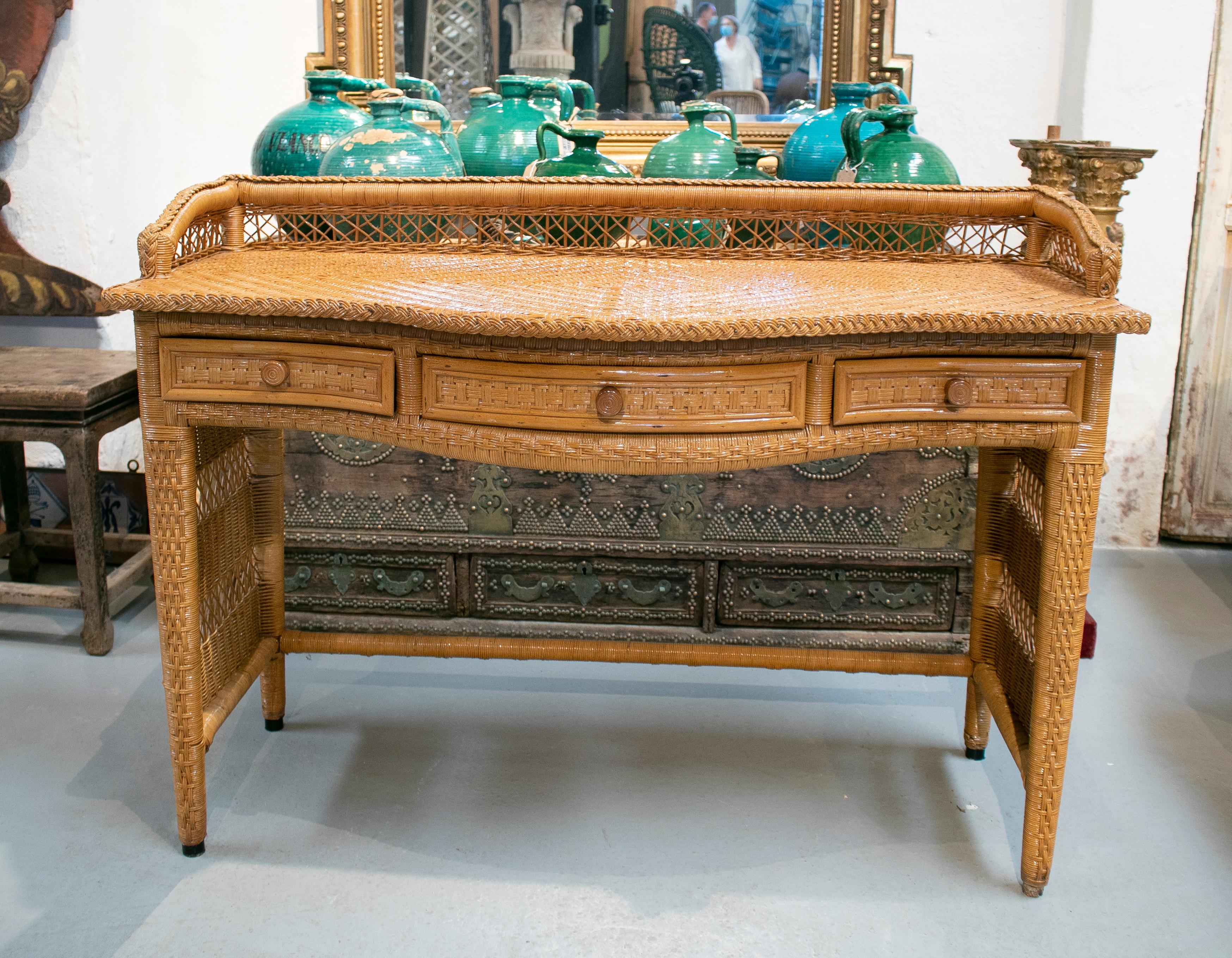 1980s Spanish weaved rattan three drawer office desk.