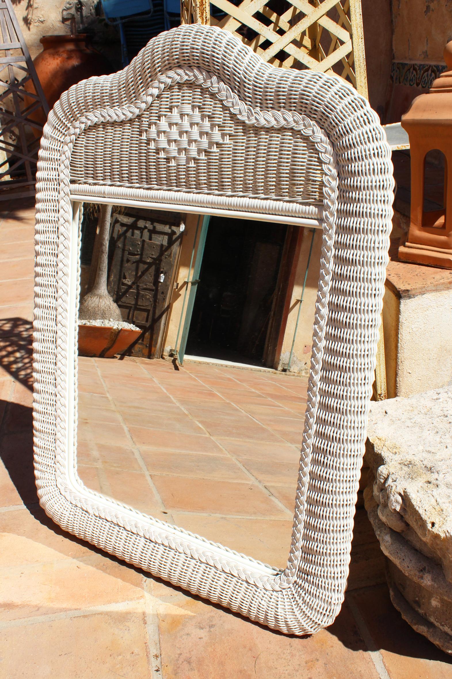 1980s Spanish white wicker framed mirror.
