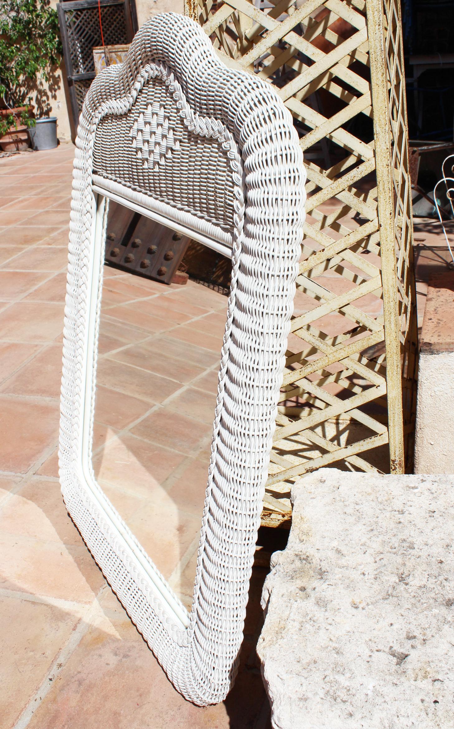 white wicker wall mirror