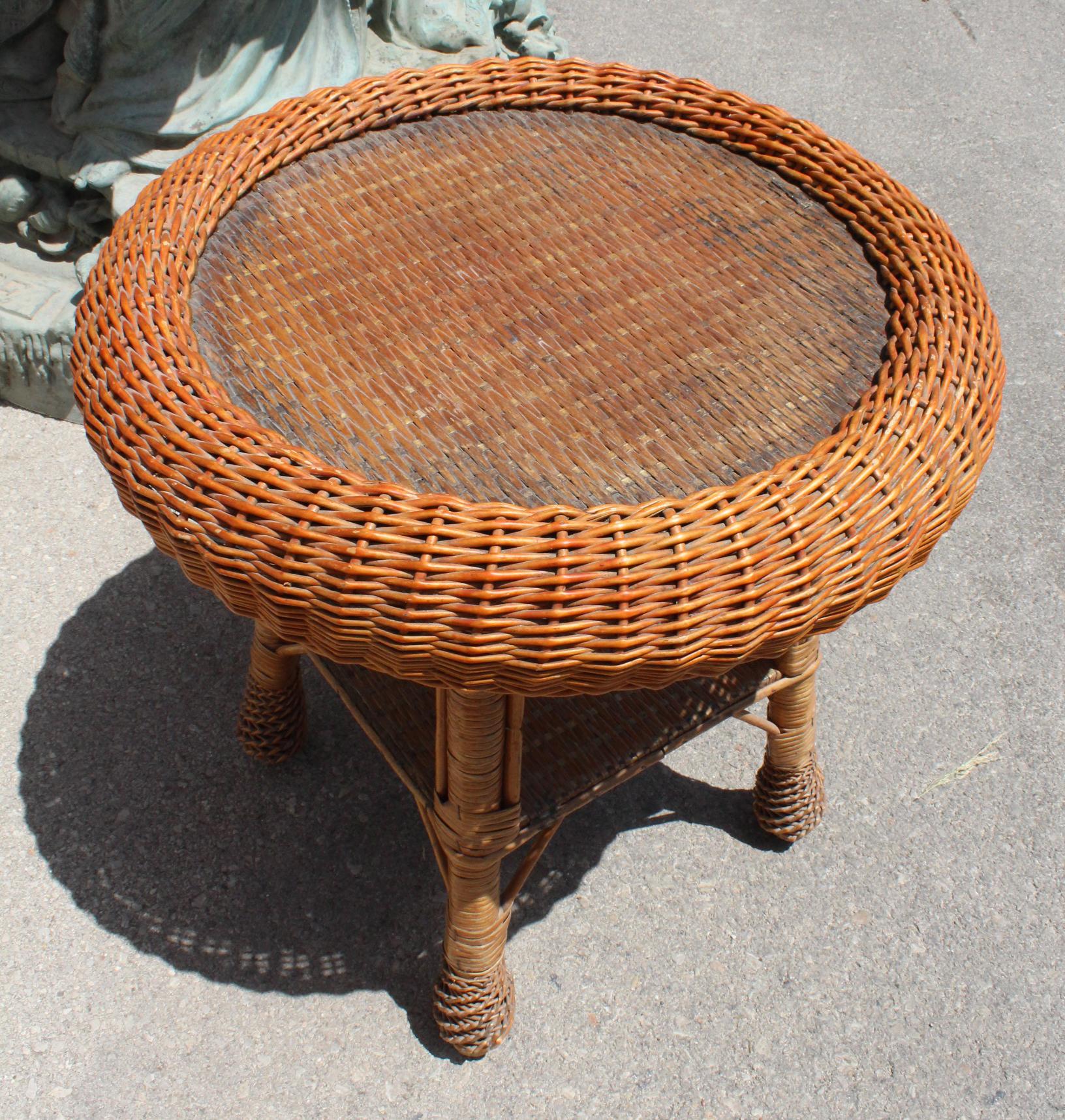 1980s Spanish handwoven wicker round side table with a glass top.