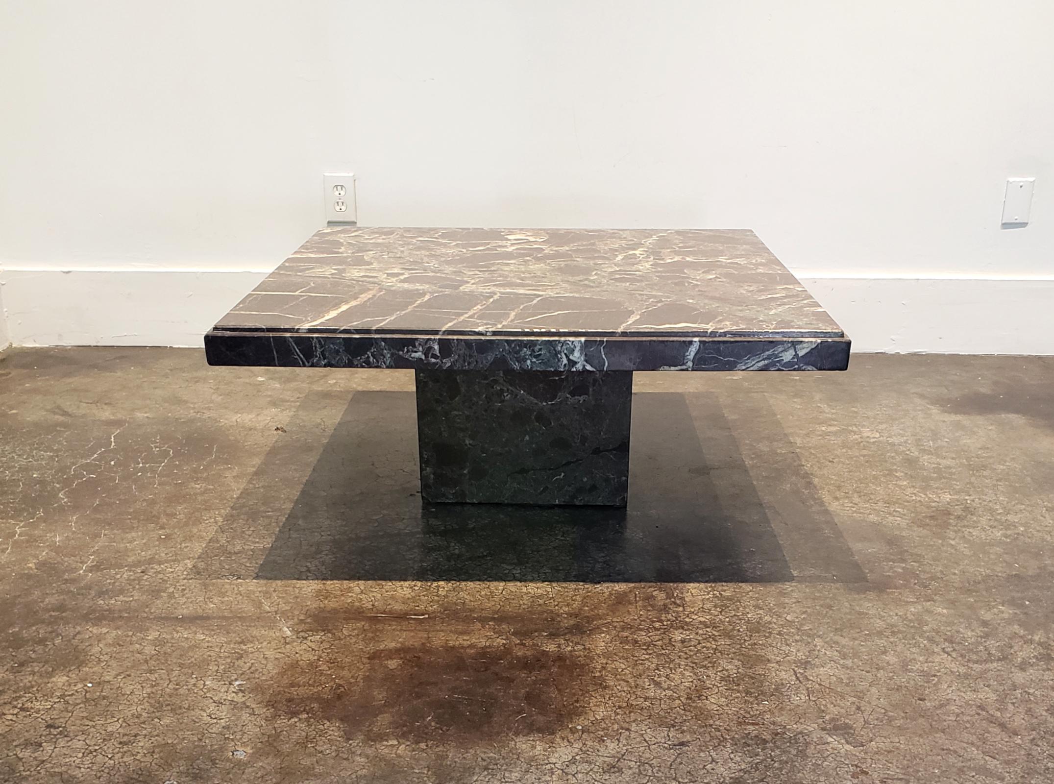 1980s Italian coffee table in stunning Rosso Levanto marble with thick varied islands of red and green shot through with white veining. Square top with tapered edge raised on cube base. In good vintage condition. Top is 39.5