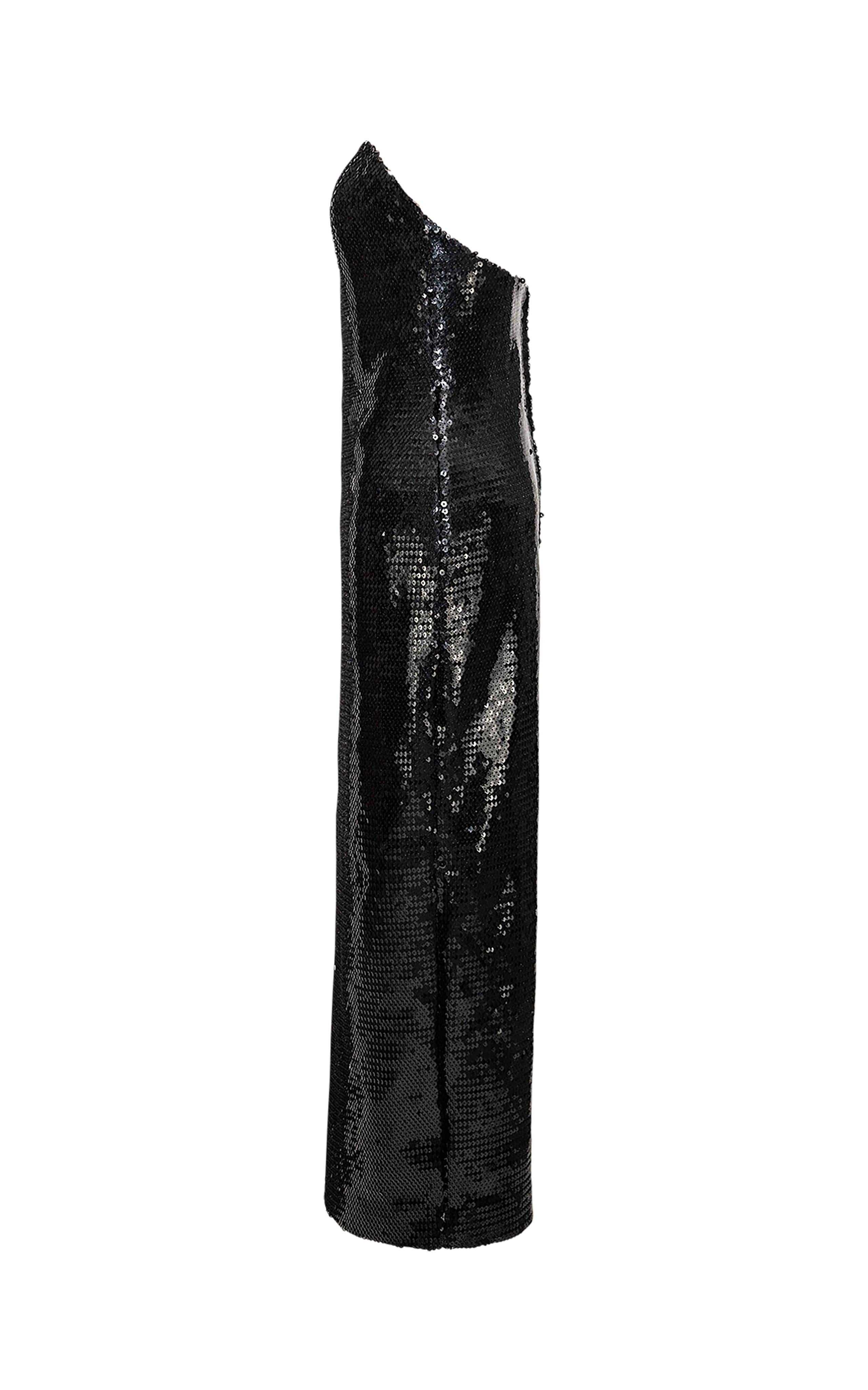 1980’s Stephen Sprouse strapless black sequin gown. Mid-sized slit in rear. Thin lining and structured bodice. Fabric has moderate stretch throughout. Due to stretch, hip fits up to 20
