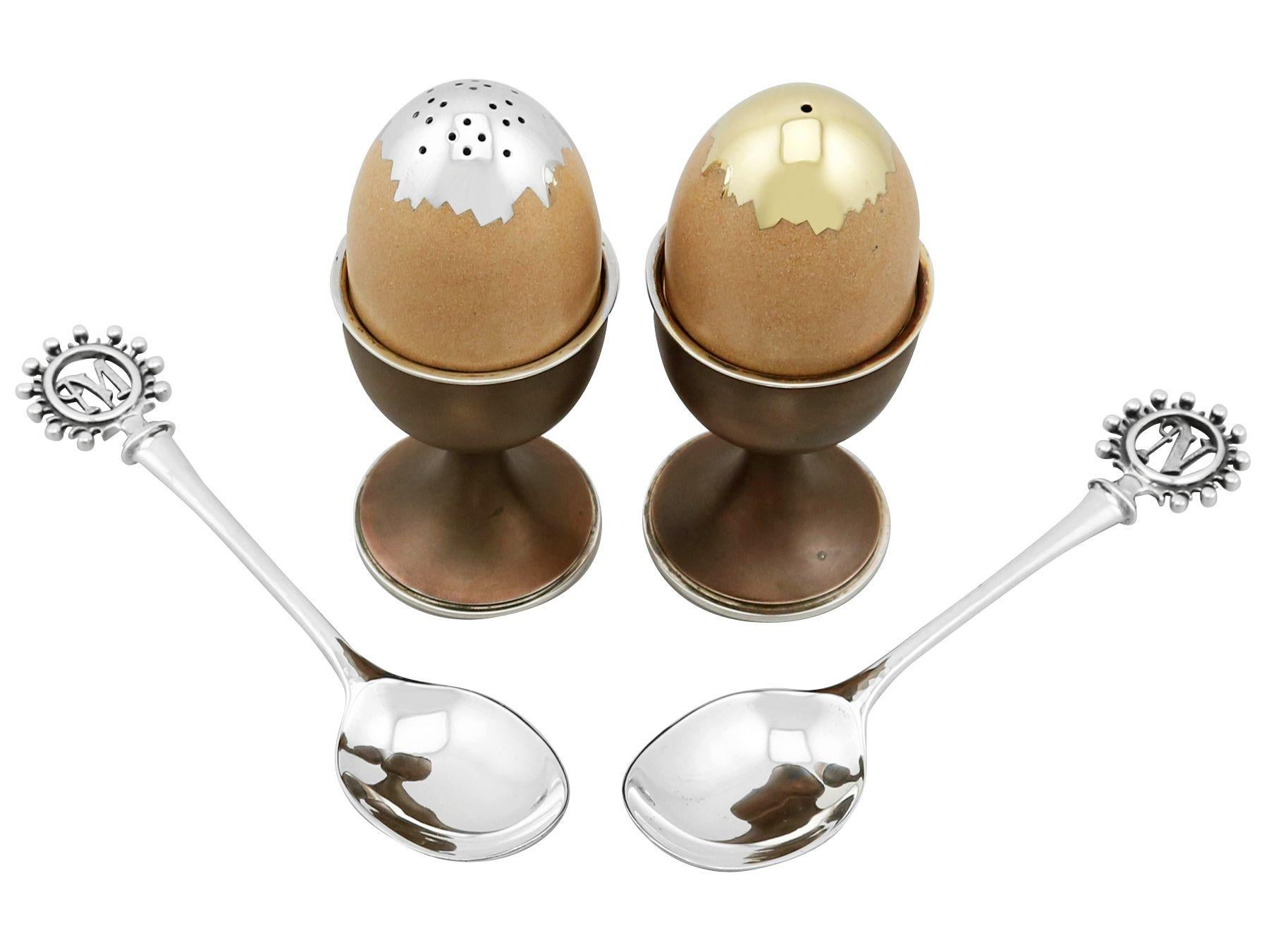 An exceptional, fine and impressive, pair of vintage English cast sterling silver and enamel salt and pepper set, in the form of a soft boiled egg in an egg holder - boxed; an addition to our silver cruets or condiments collection.
These exceptional