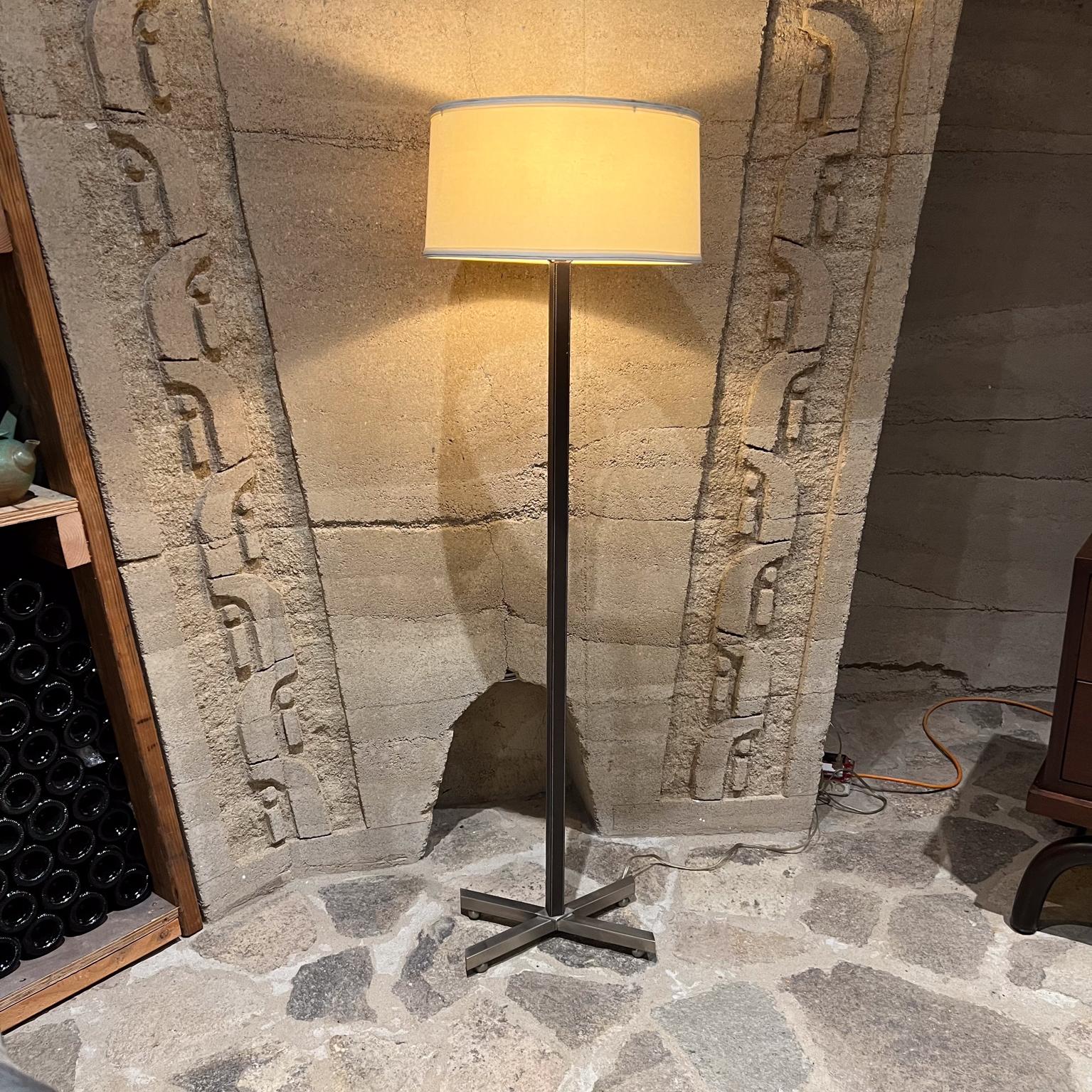 Modern Steel Leather Floor lamp
50 h to socket 54.25 to finial x 13 w x 8 d
Nickel plated steel. Base has an X shape mounted on steel balls.
Heavy base solid steel, not hollow.
No label present. In the style of Paul Dupré-Lafon.
Body appears to be