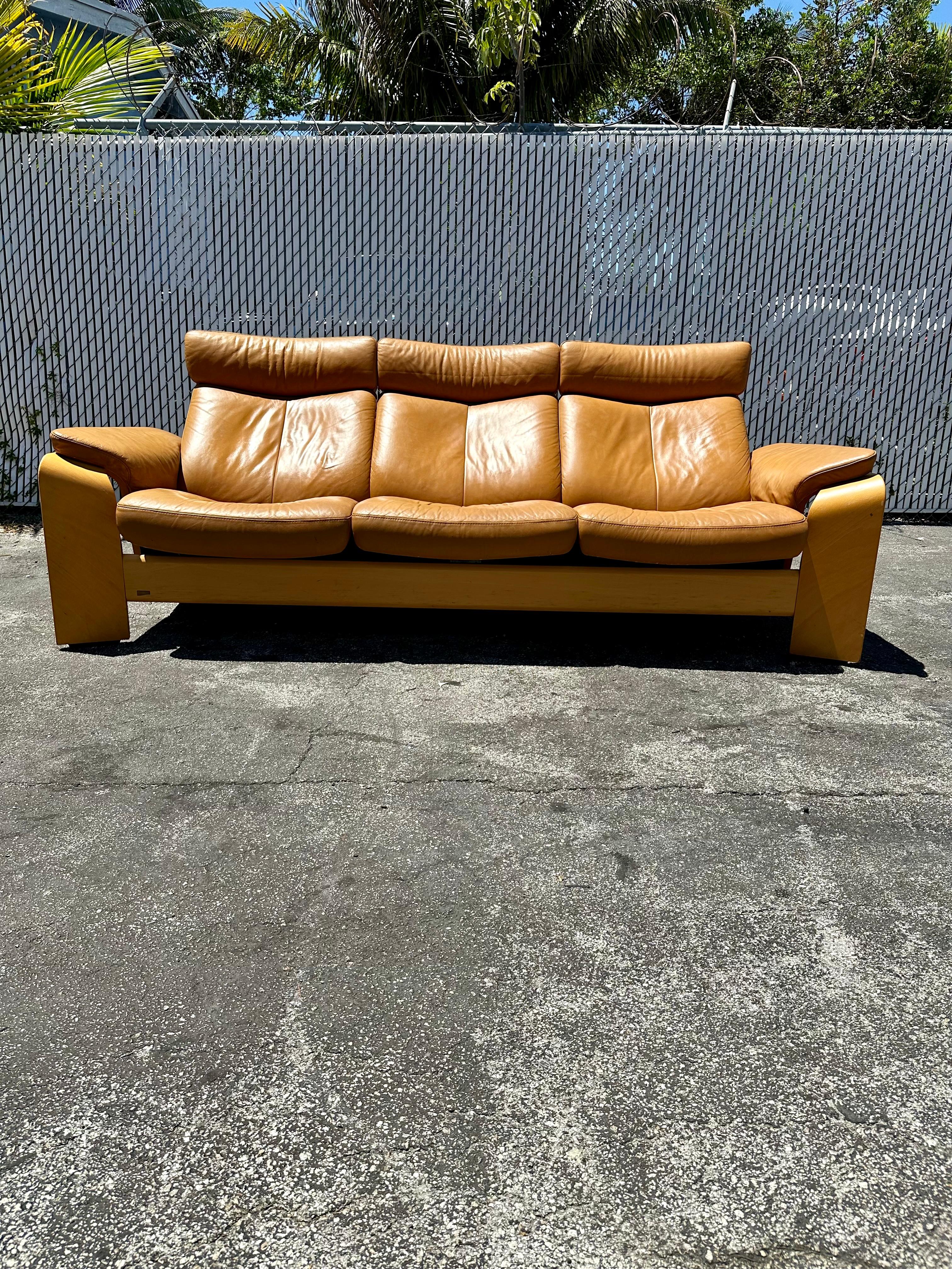 European 1980s Stressless Tan Leather Teak Wood Reclining Sofa For Sale