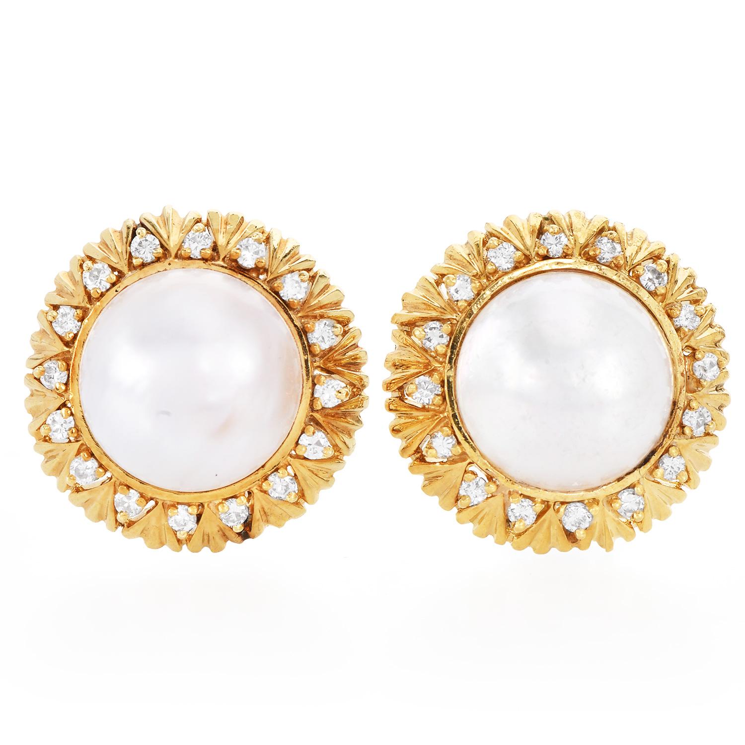 This elegant pair of estate Diamond & Pearl earrings are crafted in solid 18k yellow gold and weighs 19.2 grams. These stylish 1980's  earrings display a stunning sunflower of 32 round-cut high-quality diamonds weighing 0.50 carats, G-H color, VS