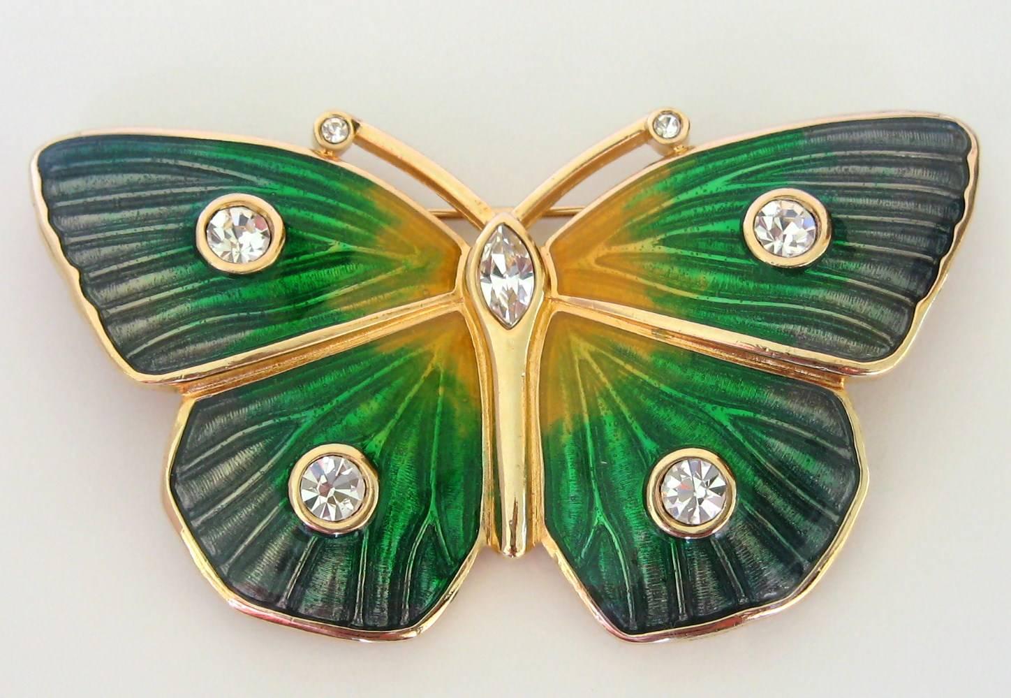 Stunning green enamel Butterfly pin made by Swarovski. 5 bezel set Crystals on the body. 2 Bezel set crystals on the antenna of this lovely Butterfly  
Measuring 2.89 in wide x 1.60 in . This is out of a massive collection of Hopi, Zuni, Navajo,
